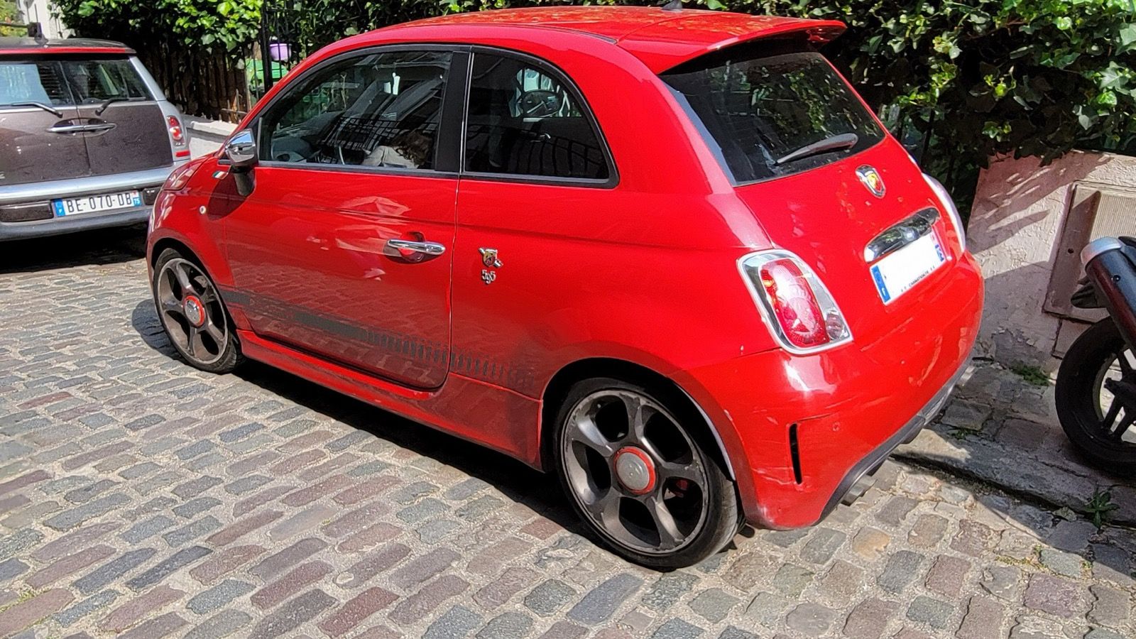 Red 2016 Abarth 595, rear three-quarter view