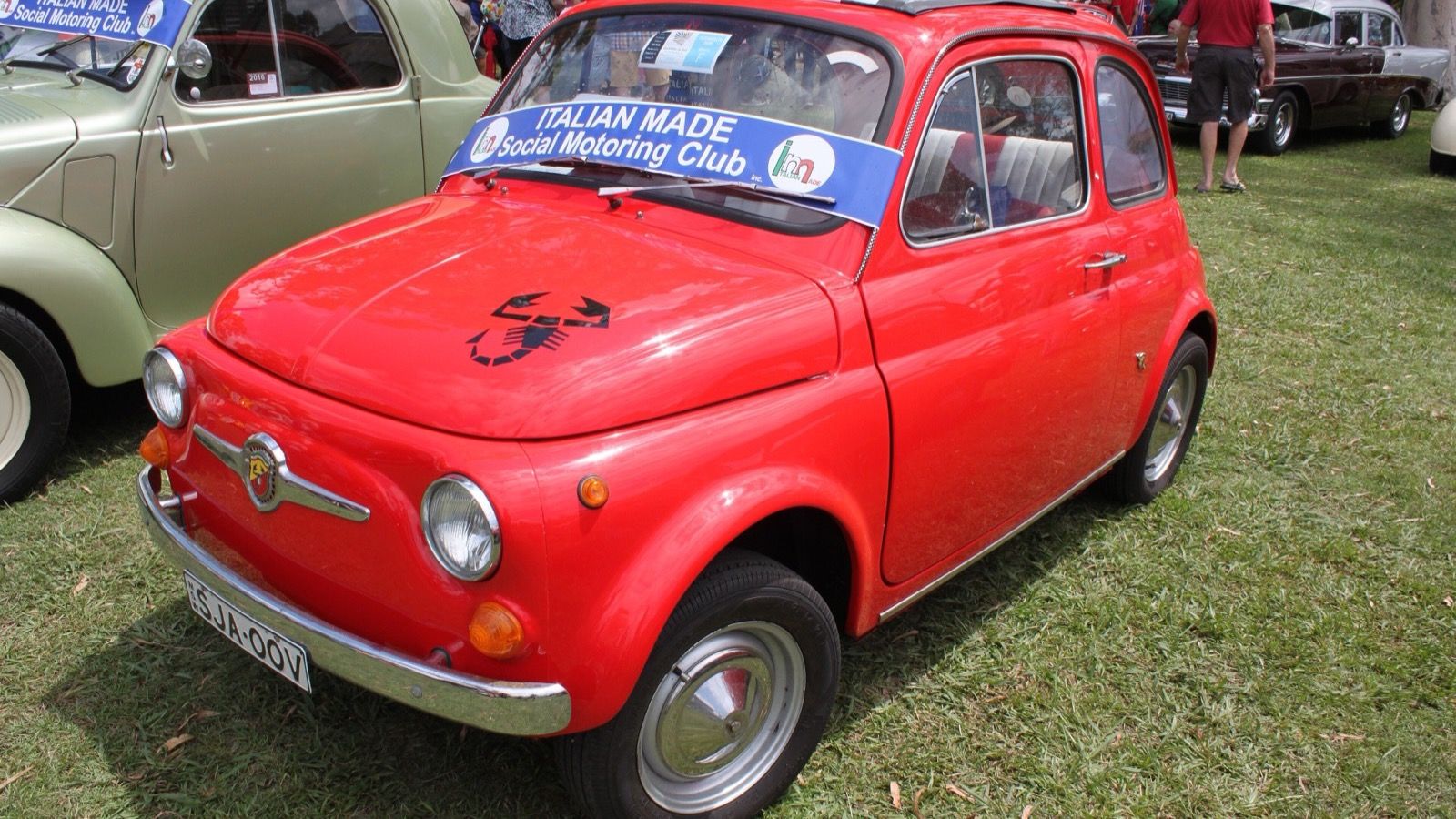 Red 1969 Fiat-Abarth 595 with Scorpion bonnet decal, front three-quarter view