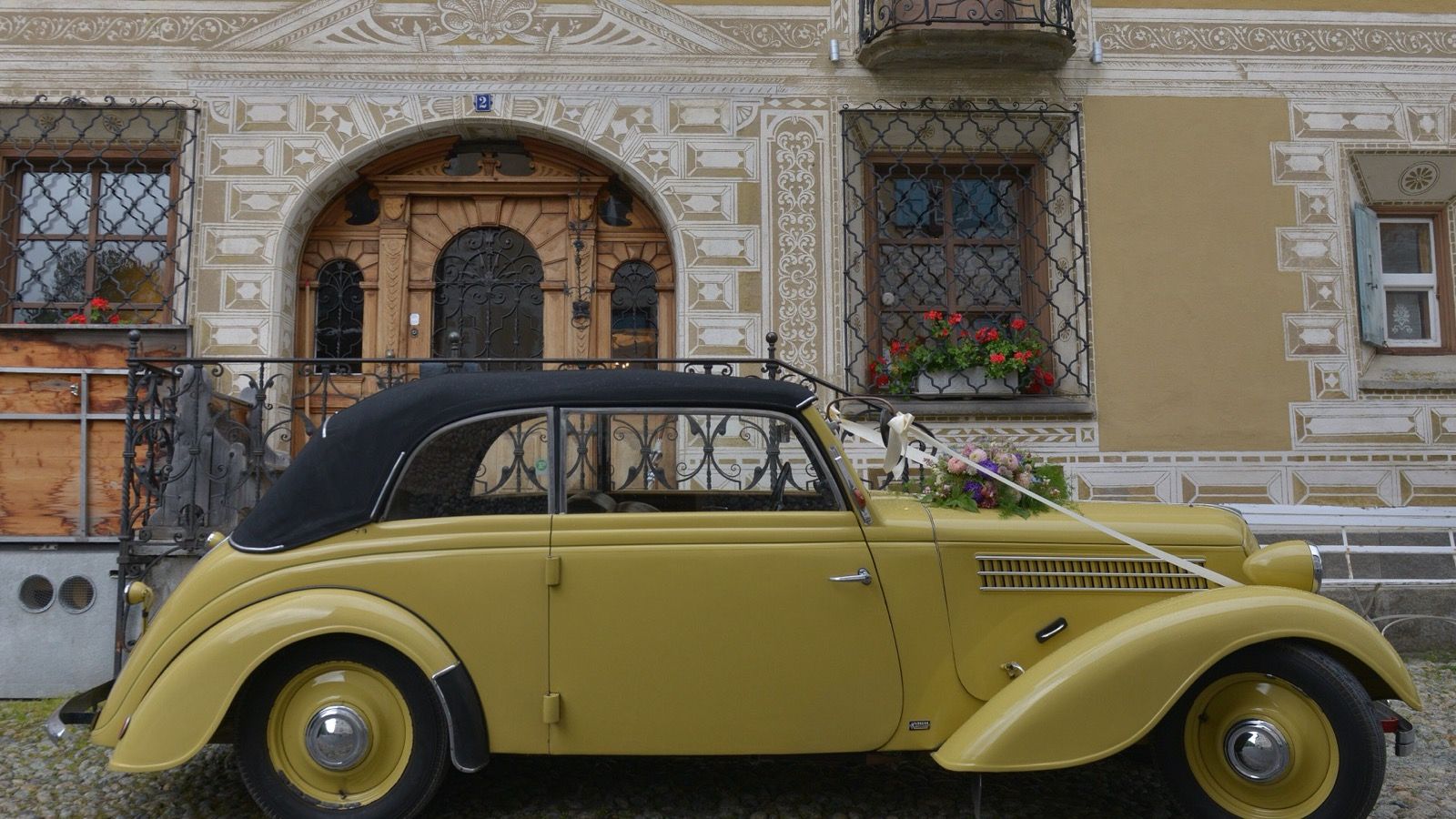 Adler Trumpf 1.7 EV cabriolet in yellow, left side profile