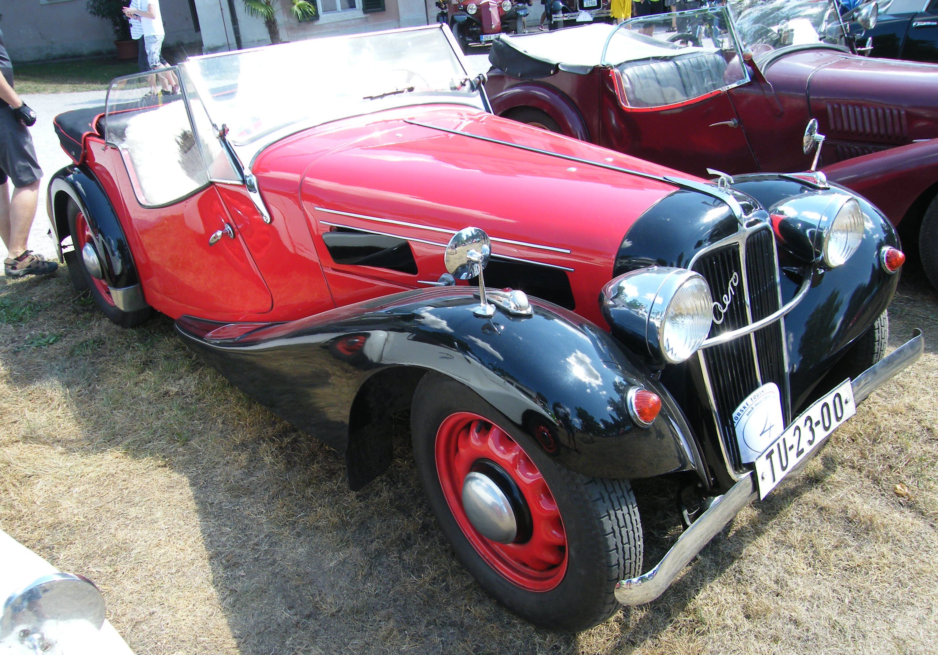 Red and black Aero 30 roadster, front three-quarter view