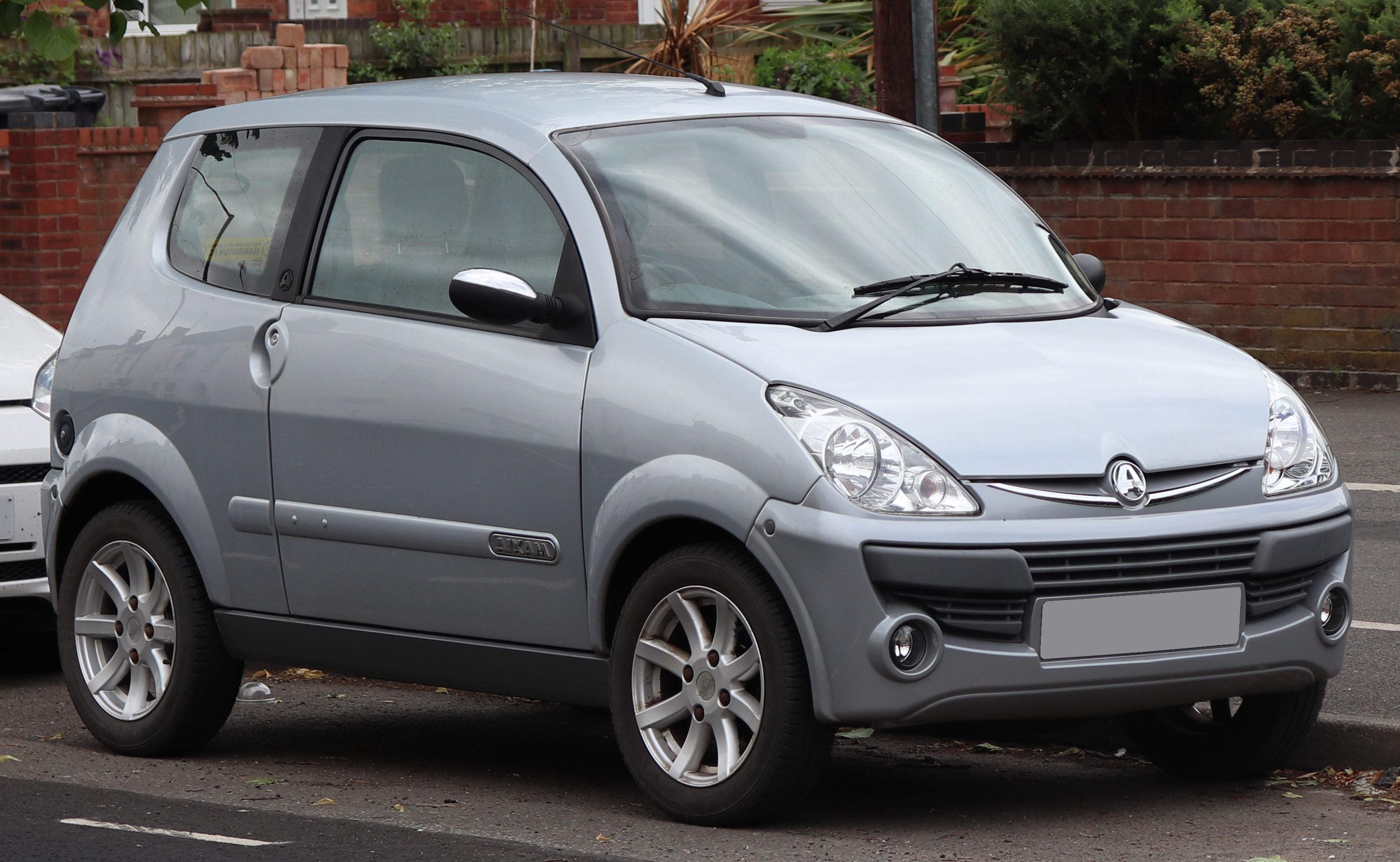Silver 2010 Aixam Crossline Super Luxe microcar, front three-quarter view