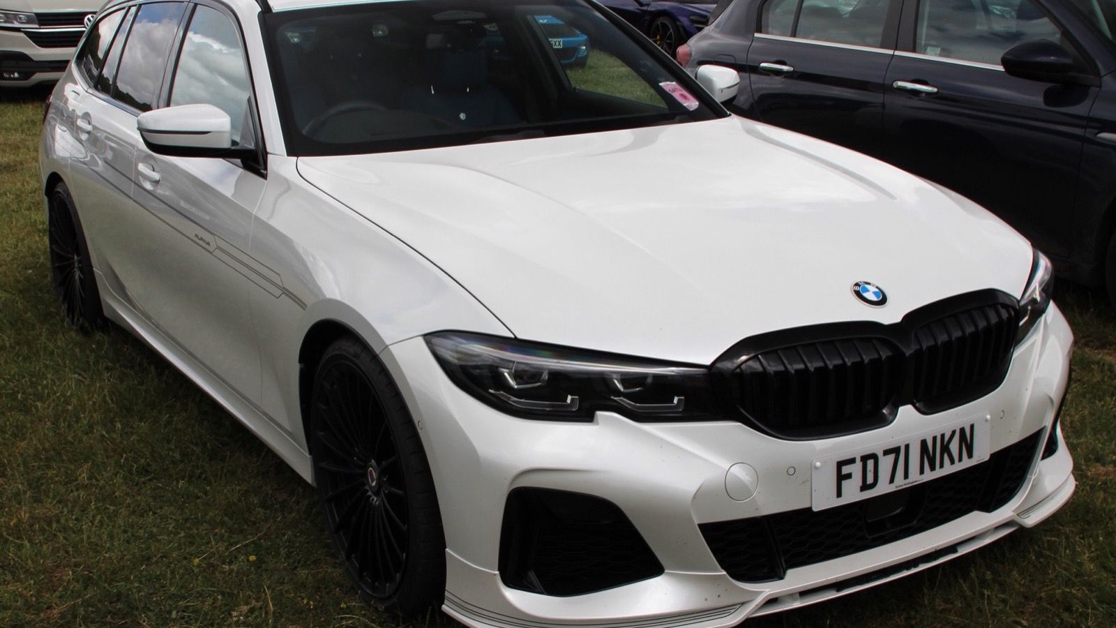 2022 Alpina B3 Touring in white (G21), side three-quarter view