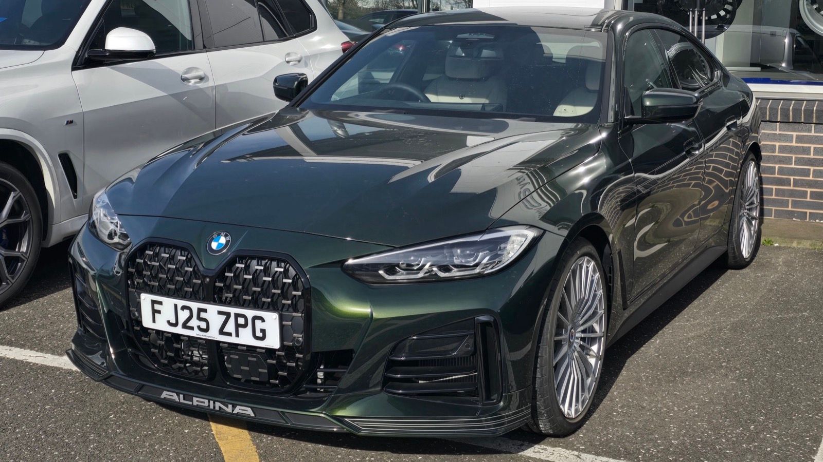 2025 BMW Alpina B4 Gran Coupé (G26), front three-quarter view