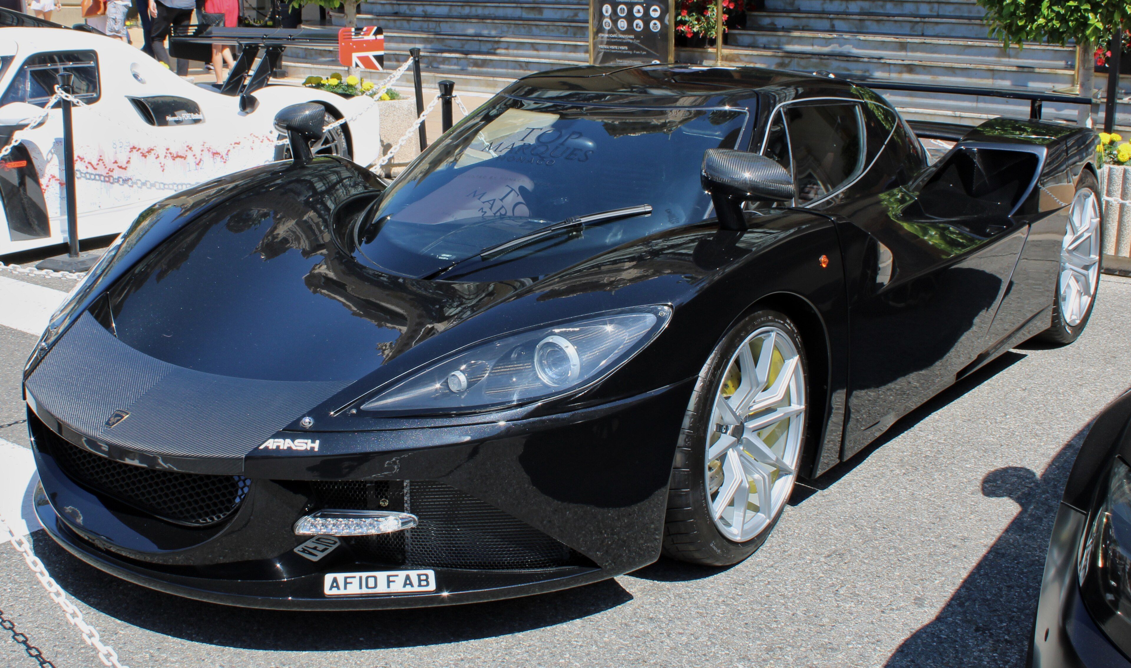 Black Arash AF10 hybrid hypercar, front three-quarter view in Monaco