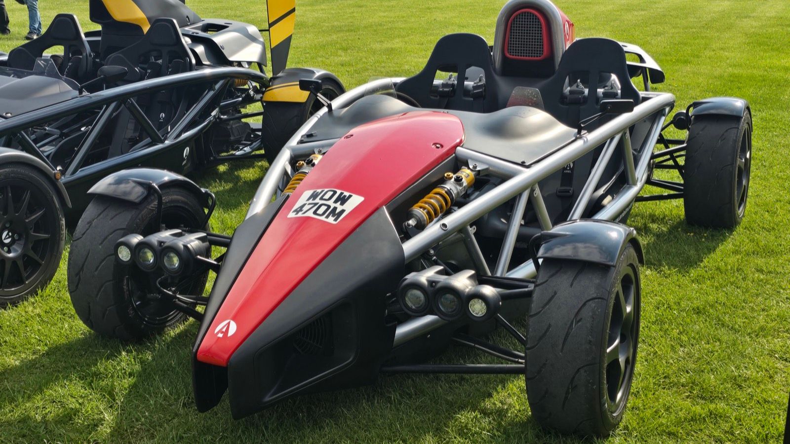 Red and black Ariel Atom 3.5 with exposed exoskeleton, front three-quarter view