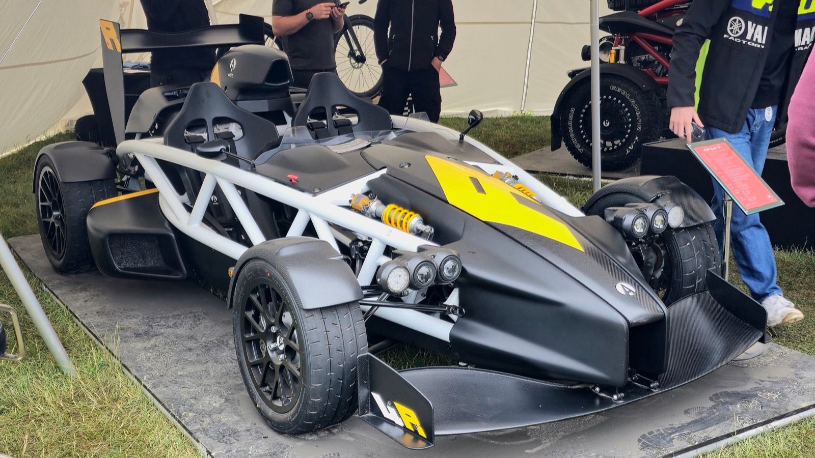 Carbon and yellow Ariel Atom 4R track special, front three-quarter view