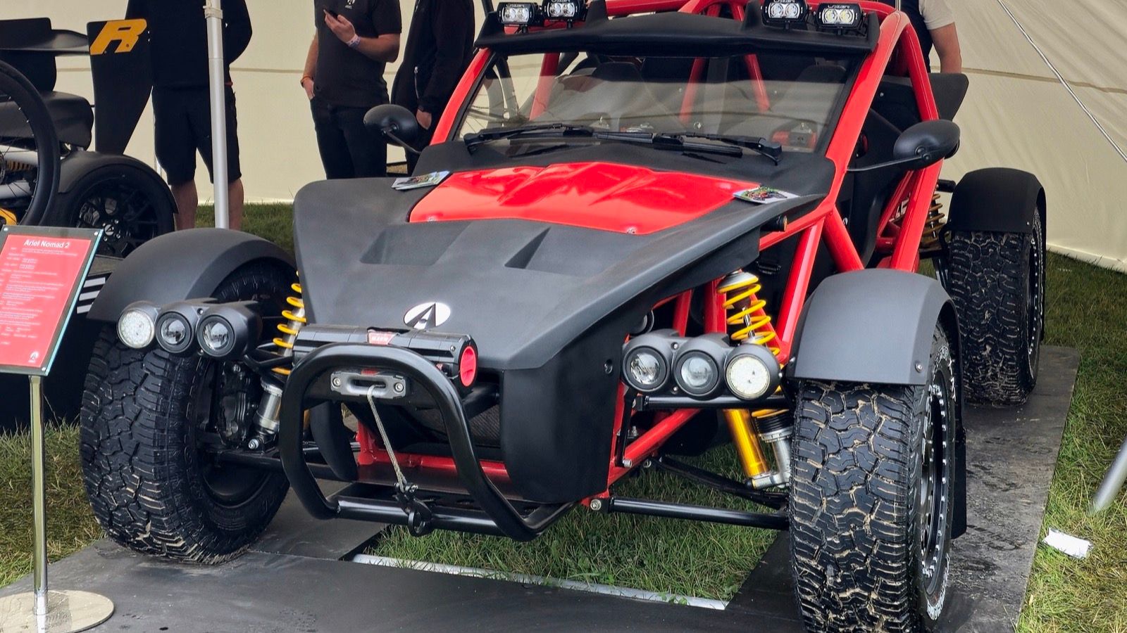 Red-framed Ariel Nomad 2 off-road buggy with winch and light bar, front three-quarter view