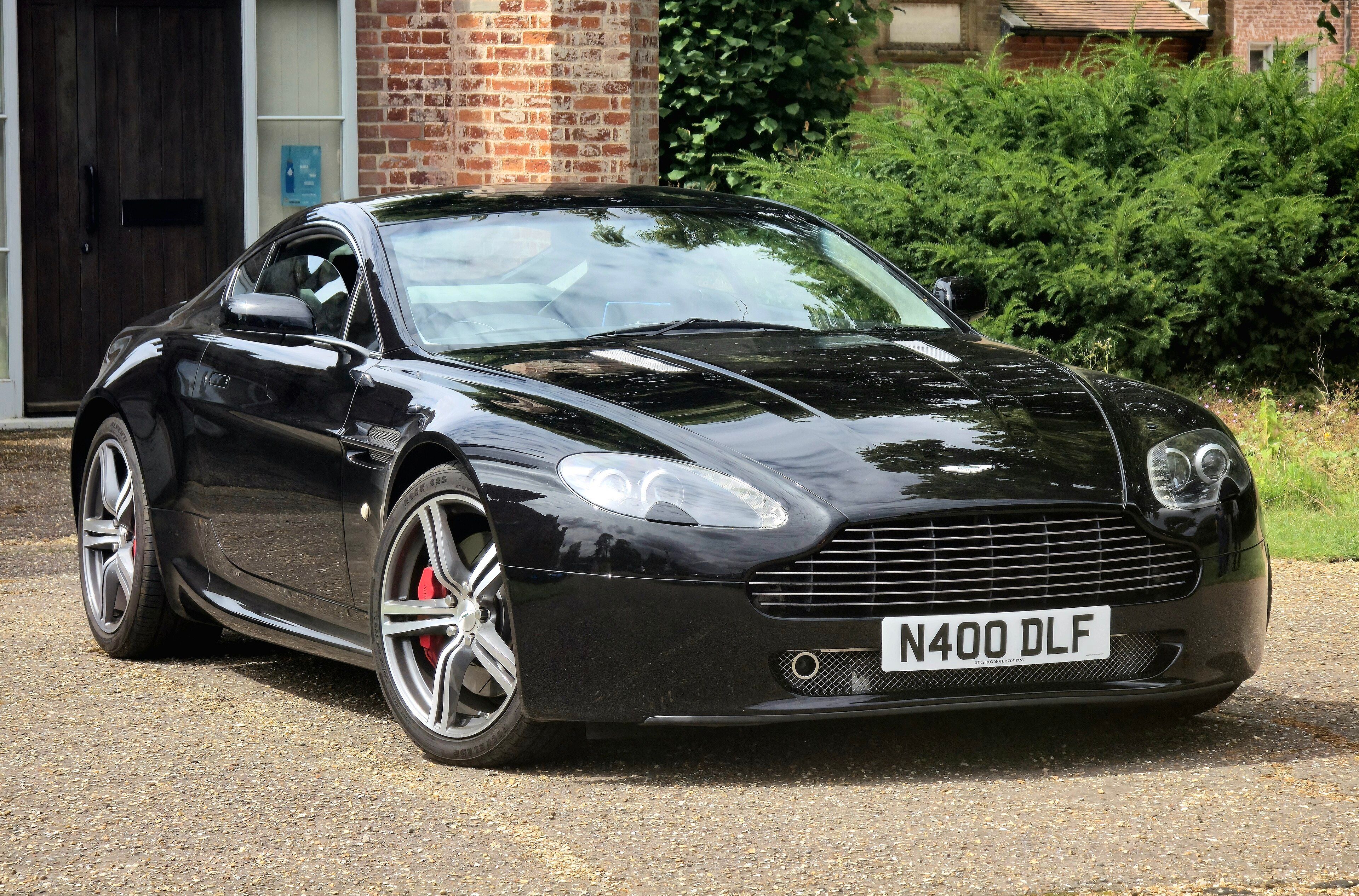 2008 Aston Martin V8 Vantage coupe in black, front three-quarter view