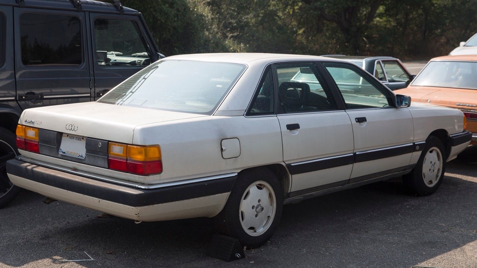 1991 Audi 100 (C4) in pearl white, rear three-quarter view