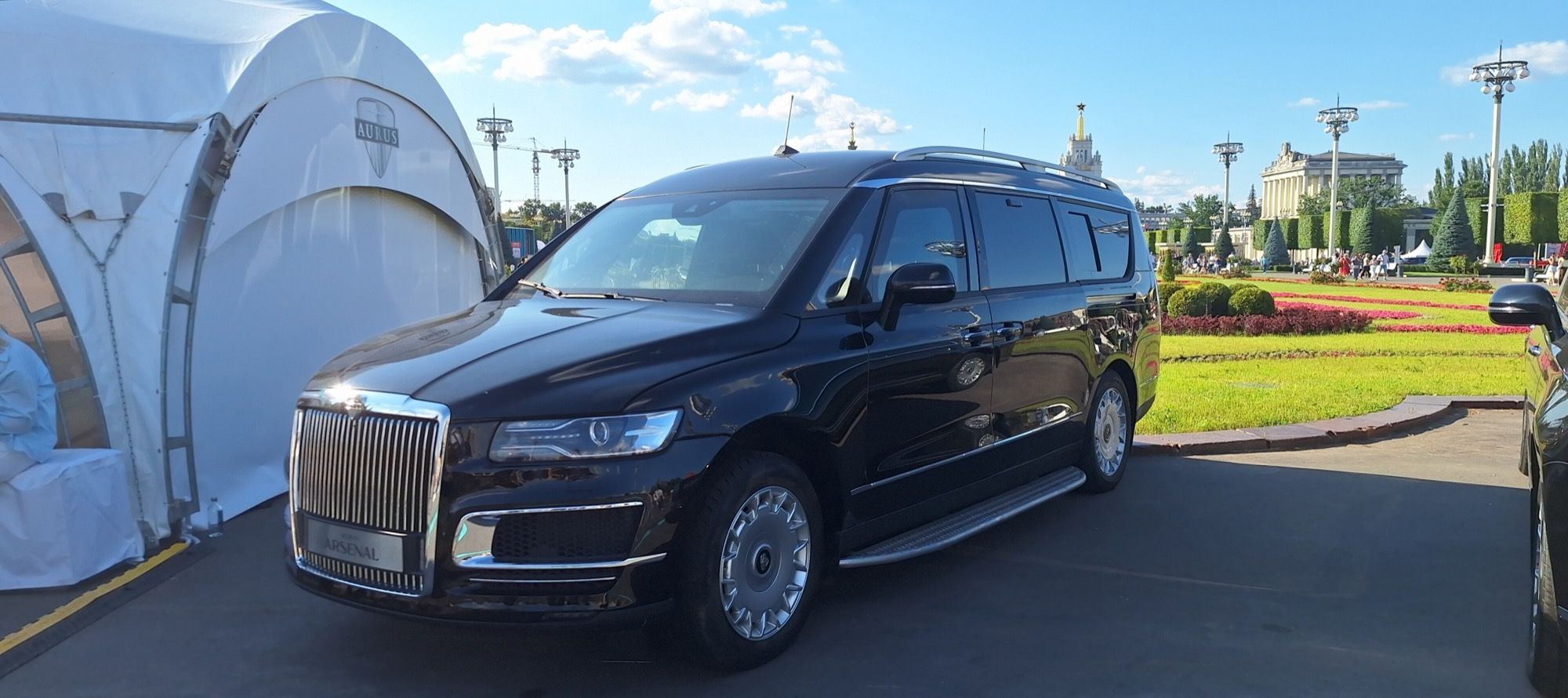 Black Aurus Arsenal first-generation luxury minivan, front three-quarter view, displayed in Moscow in 2025