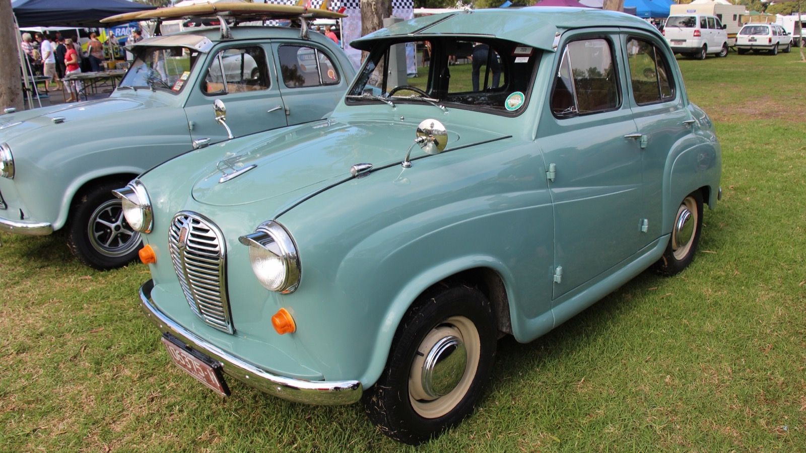 Green 1953 Austin A30 four-door saloon, front three-quarter view