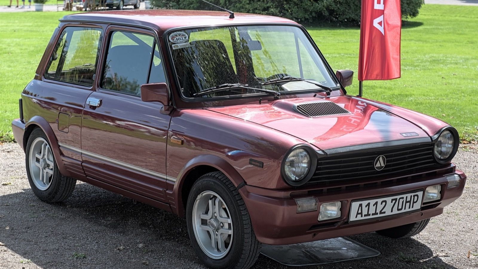 1984 Autobianchi A112 Abarth in maroon, front three-quarter view