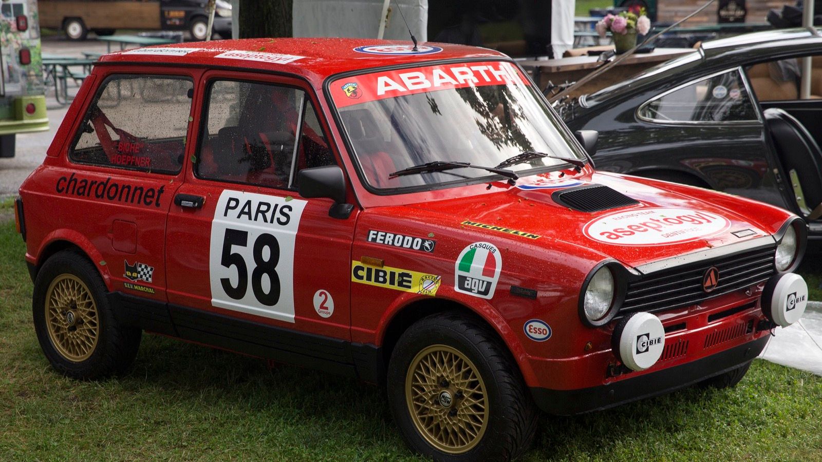 1985 Autobianchi A112 Abarth in red Team Chardonnet rally livery, front three-quarter view