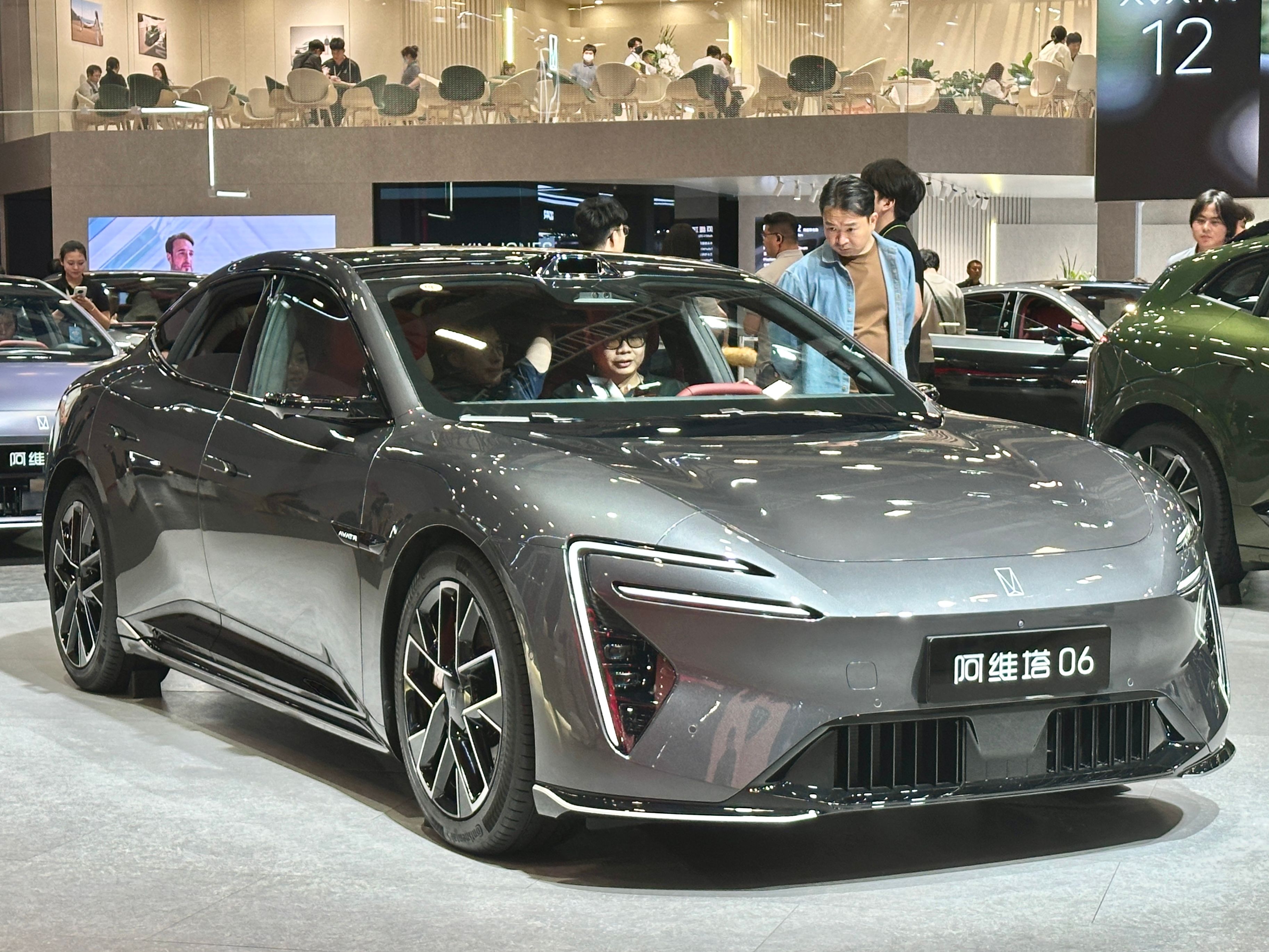 Grey 2025 Avatr 06 sedan on display, front three-quarter view