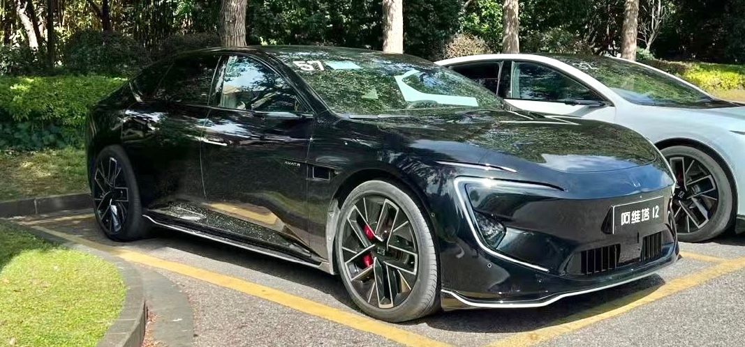 Black 2023 Avatr 12 executive fastback sedan, front three-quarter view
