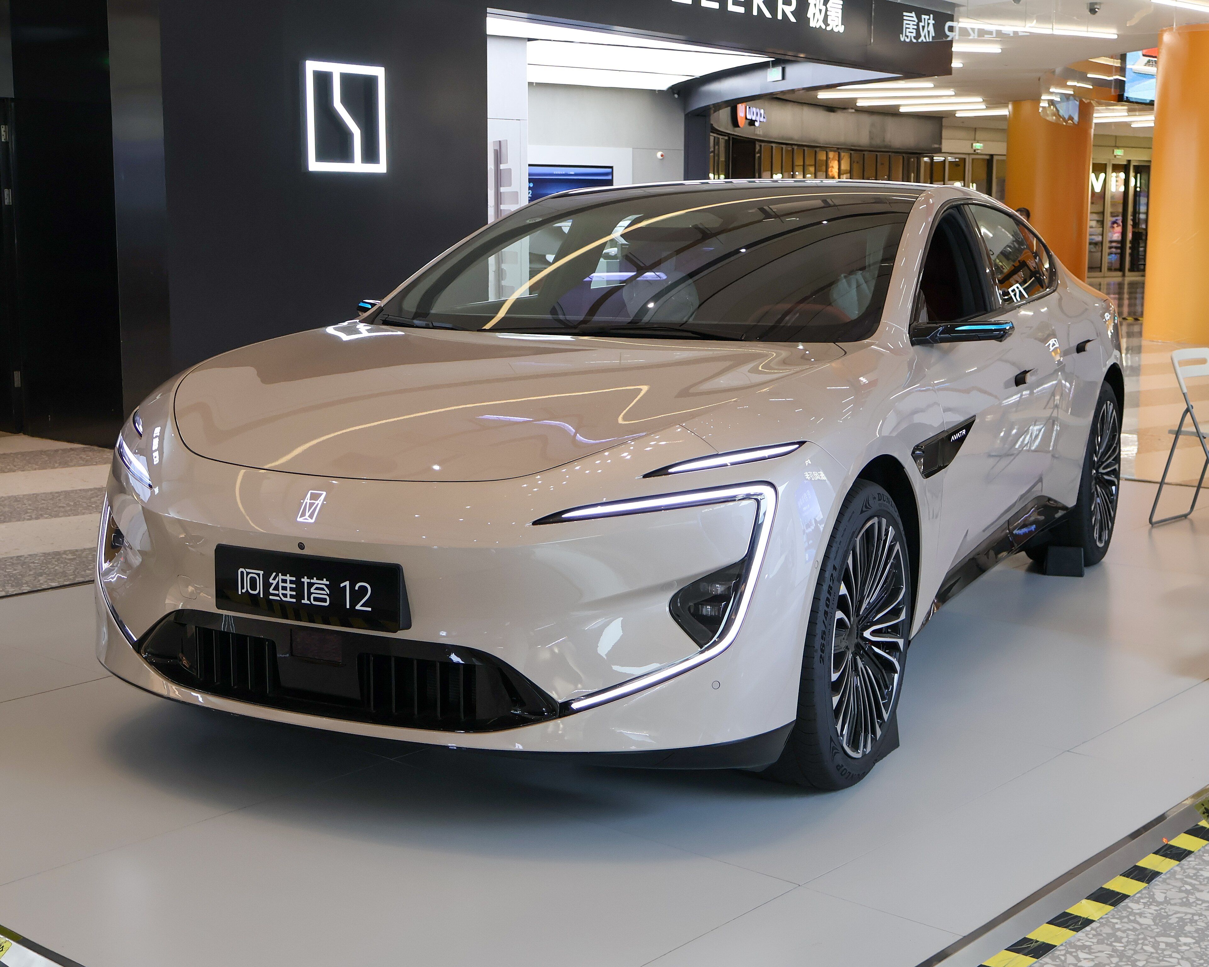 Champagne 2025 Avatr 12 sedan on display, front three-quarter view