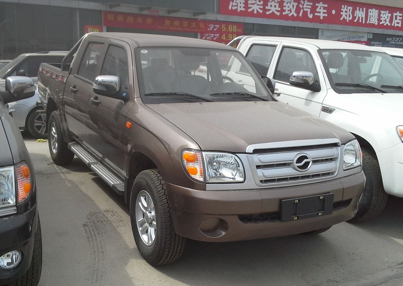 Brown Zhongxing Grand Tiger 2 double-cab pickup, front three-quarter view