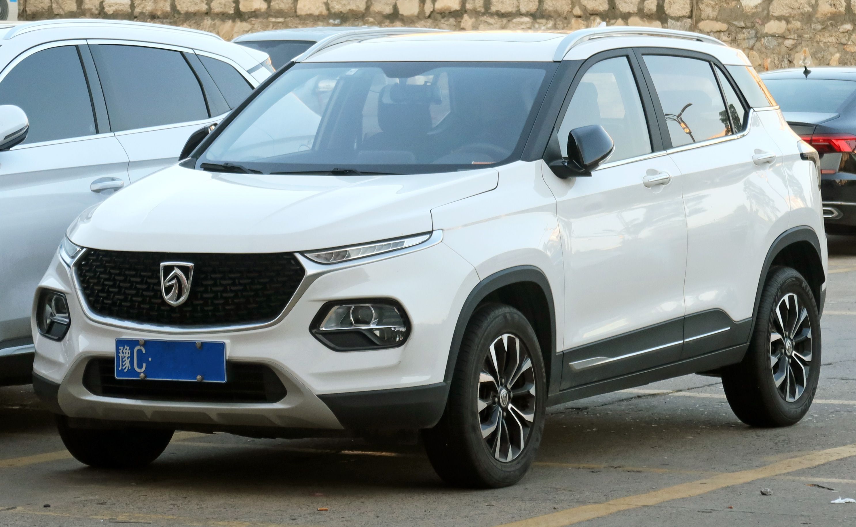 White facelifted 2021 Baojun 510 subcompact SUV, front three-quarter view