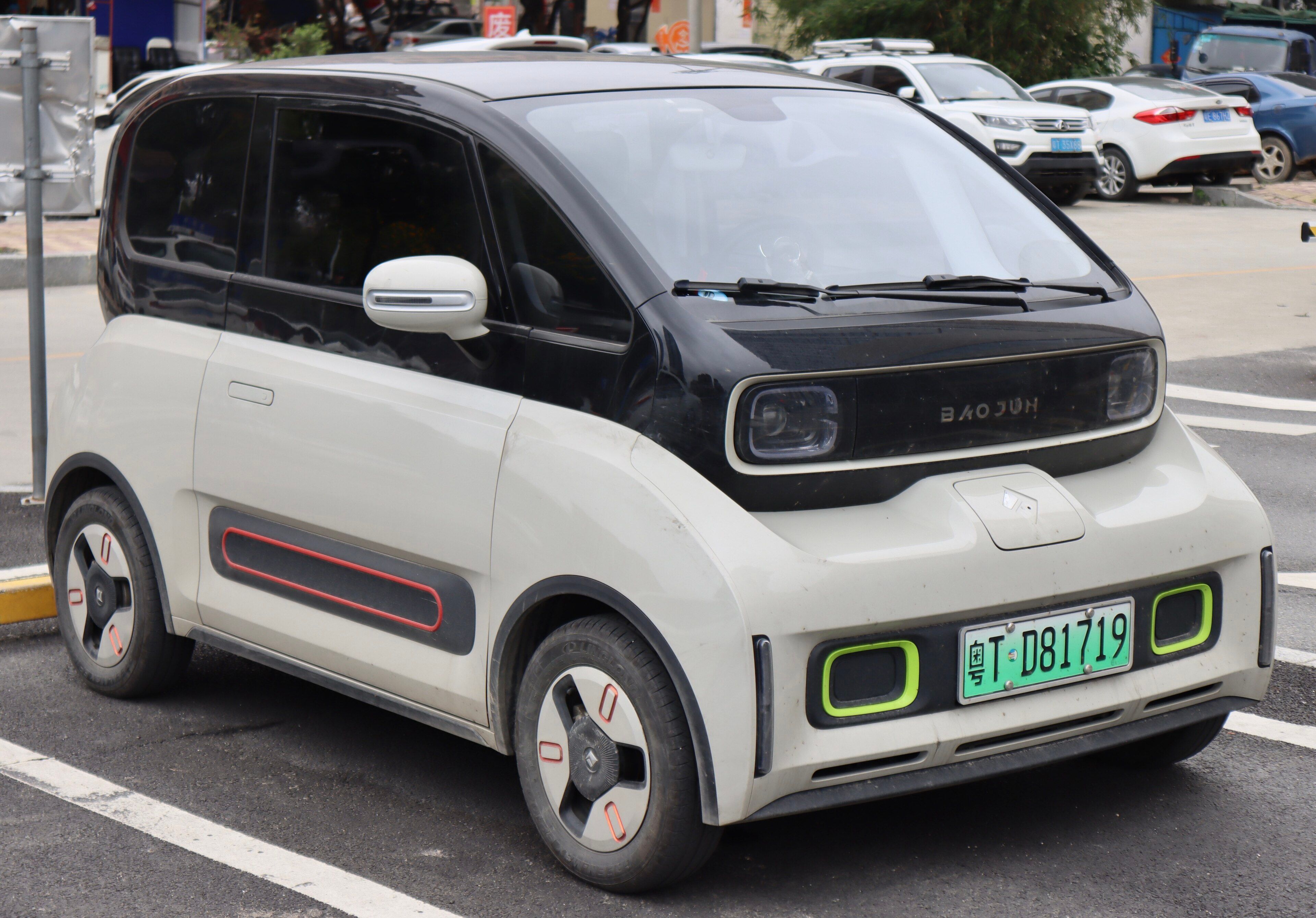 White and black Baojun KiWi EV city car, front three-quarter view