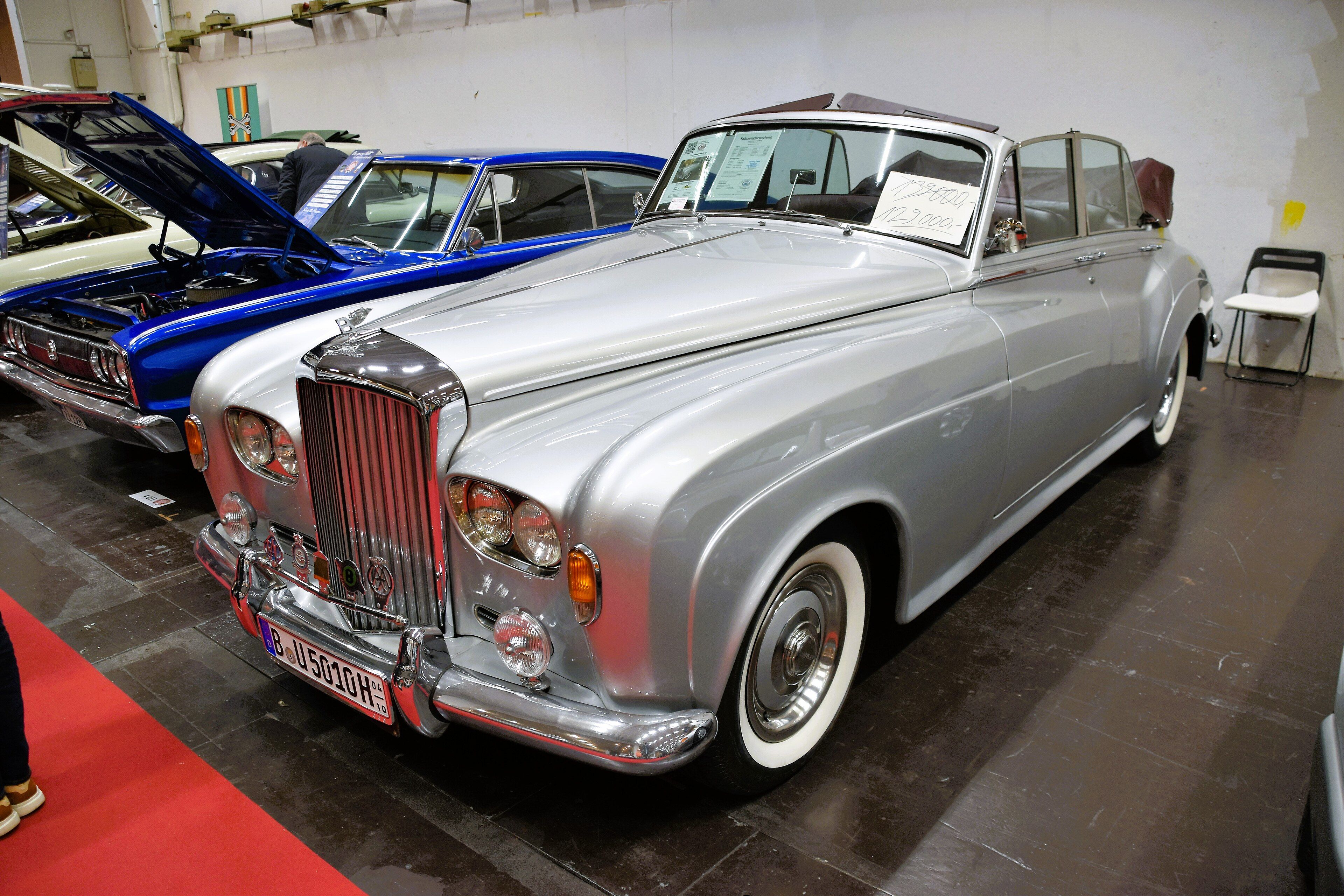 Silver 1963 Bentley S3 cabriolet with quad headlamps, front three-quarter view