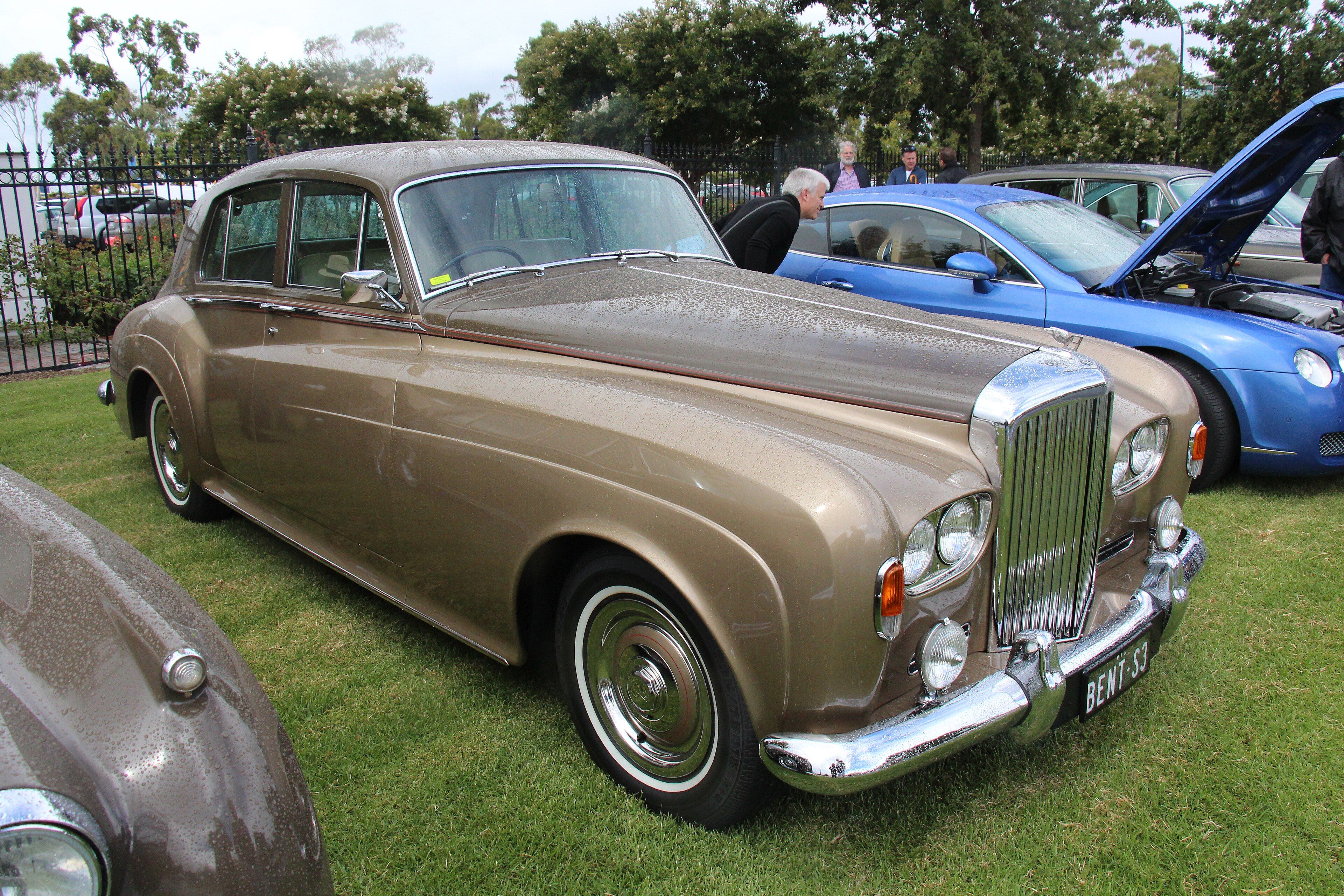 Gold 1964 Bentley S3 standard saloon with quad headlamps, front three-quarter view