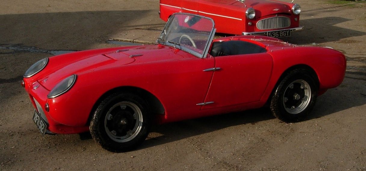 Red Berkeley SA322 roadster, front three-quarter side profile with top down