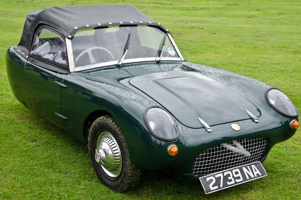 Dark green 1959 Berkeley T60 three-wheeler with soft top, front three-quarter view