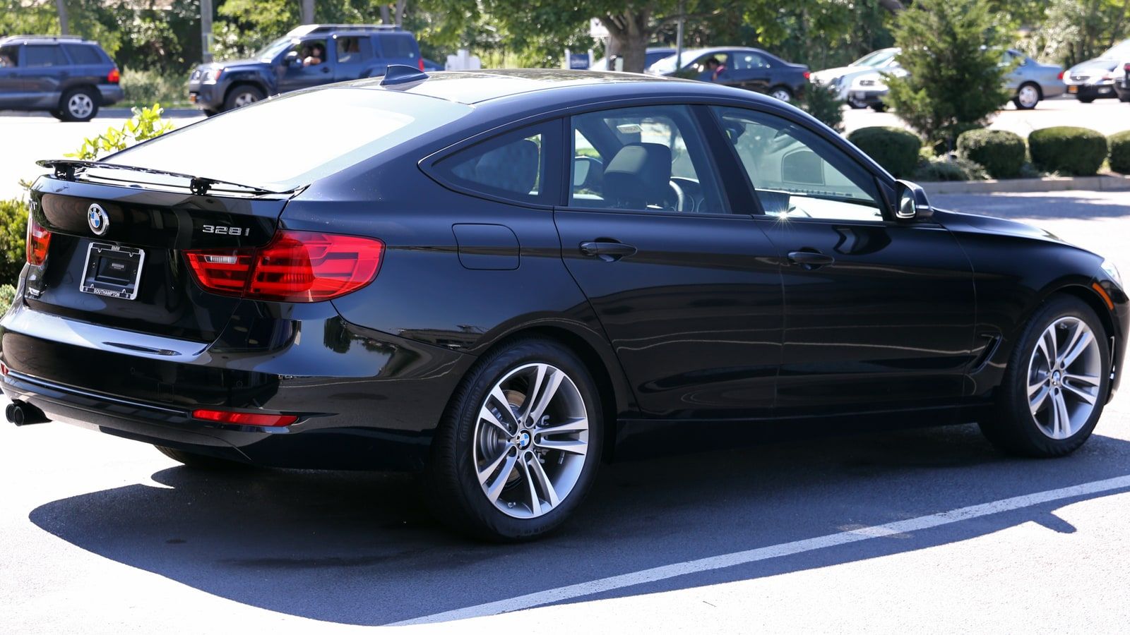 2014 BMW 328i xDrive Gran Turismo Sport Line, rear three-quarter view
