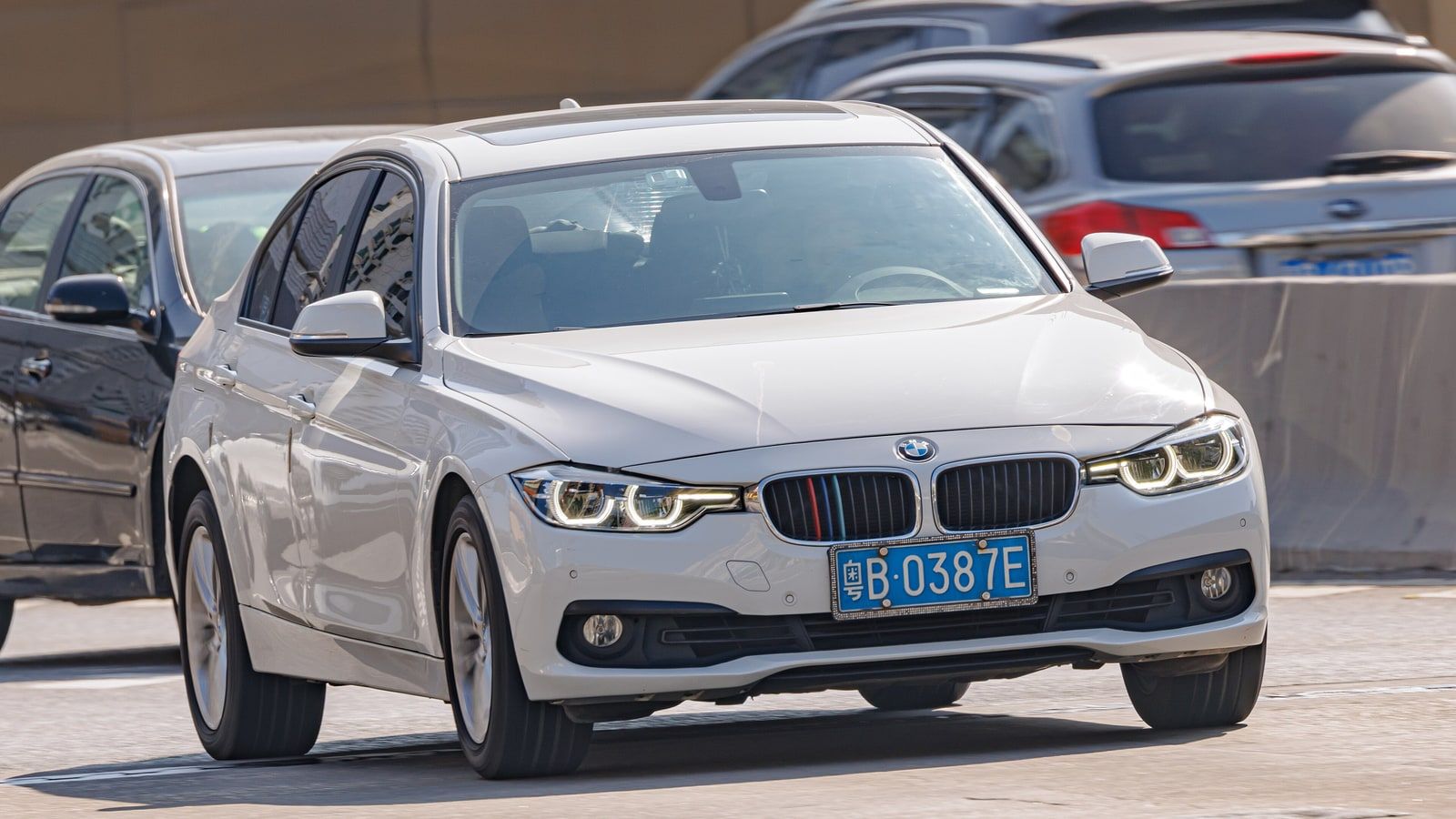2015 BMW 3 Series (F30, sixth generation) — white sedan, front three-quarter view