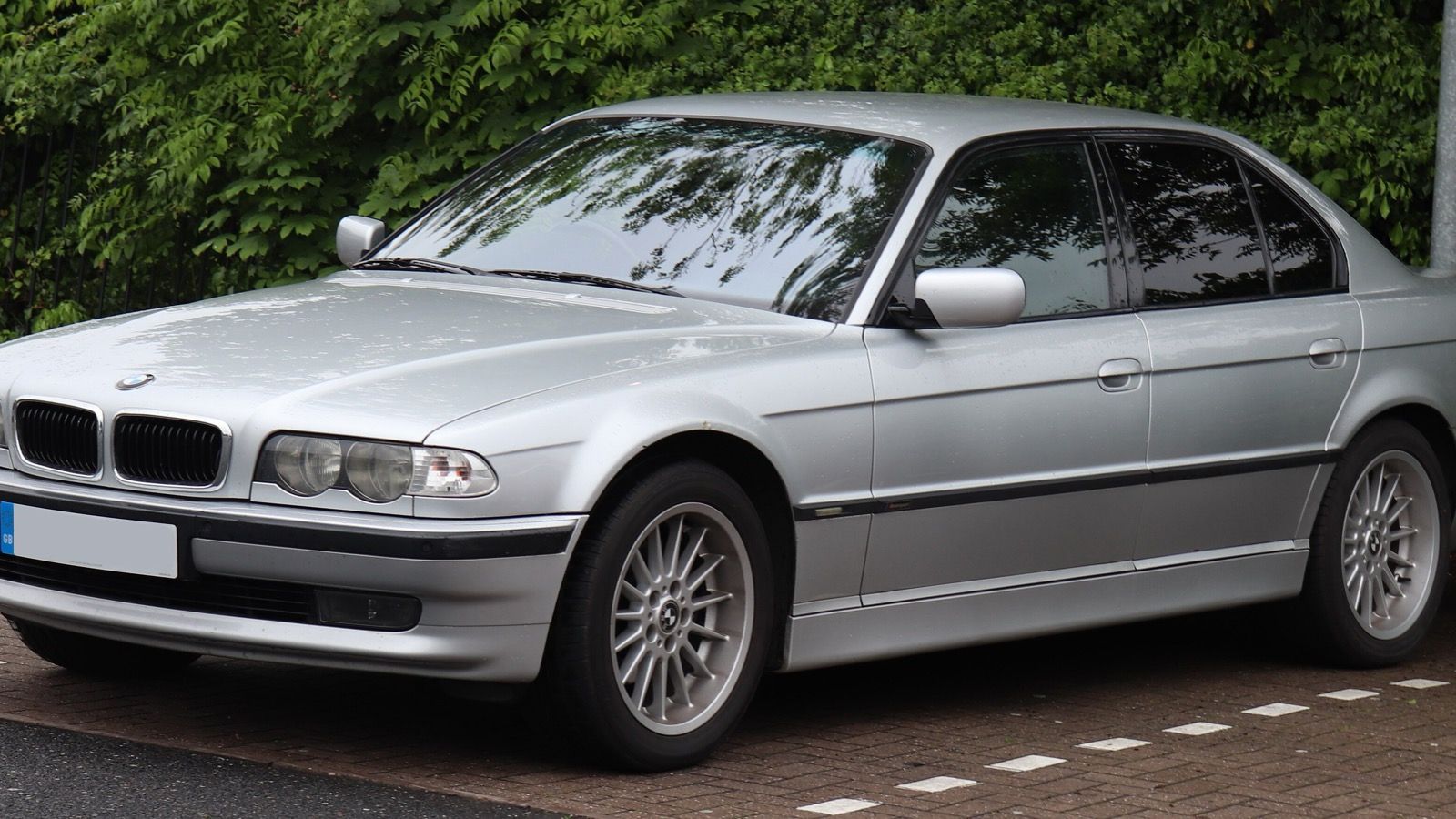 Silver BMW 728i Sport (E38) 7 Series sedan, front three-quarter view