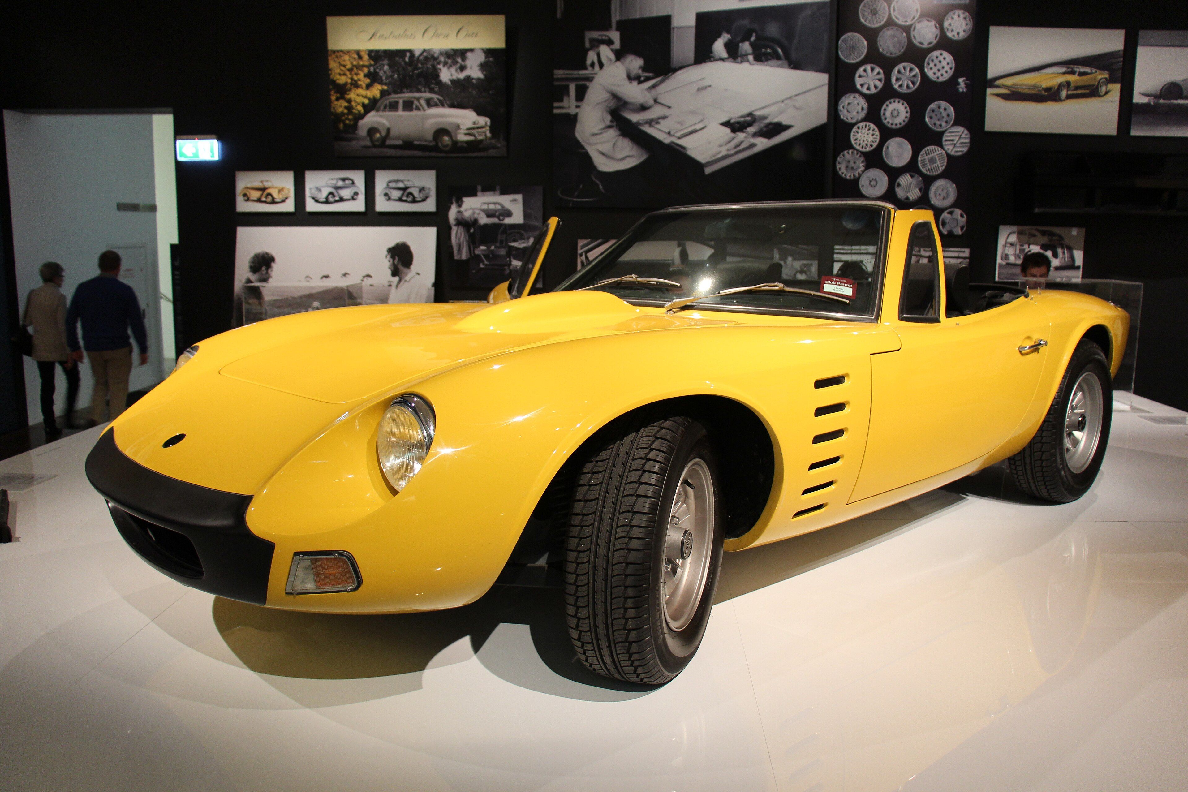 Yellow 1972 Bolwell Nagari Mk VIII convertible with top down, front three-quarter view