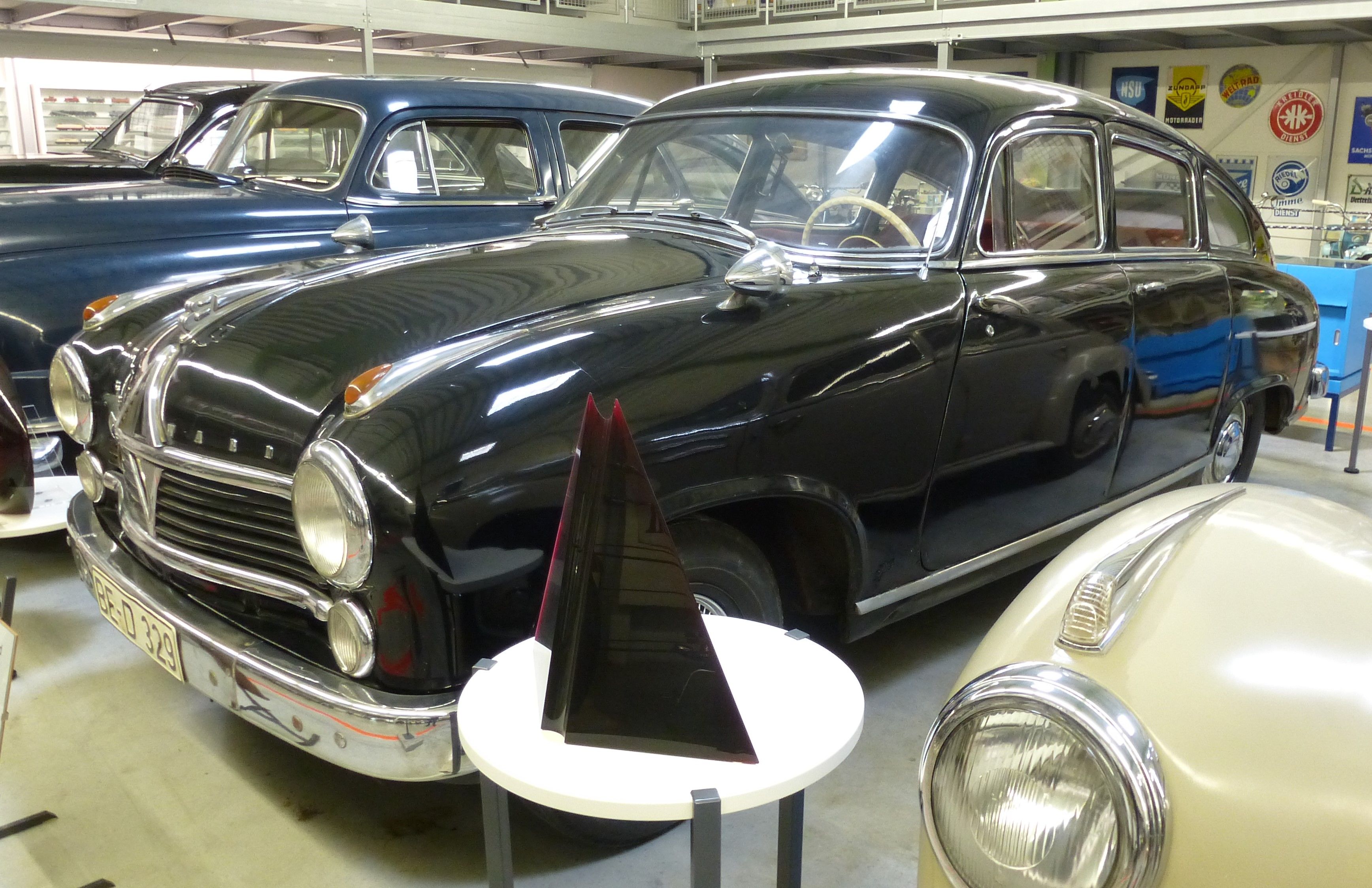 Black 1952 Borgward Hansa 2400 saloon in a museum, front three-quarter view