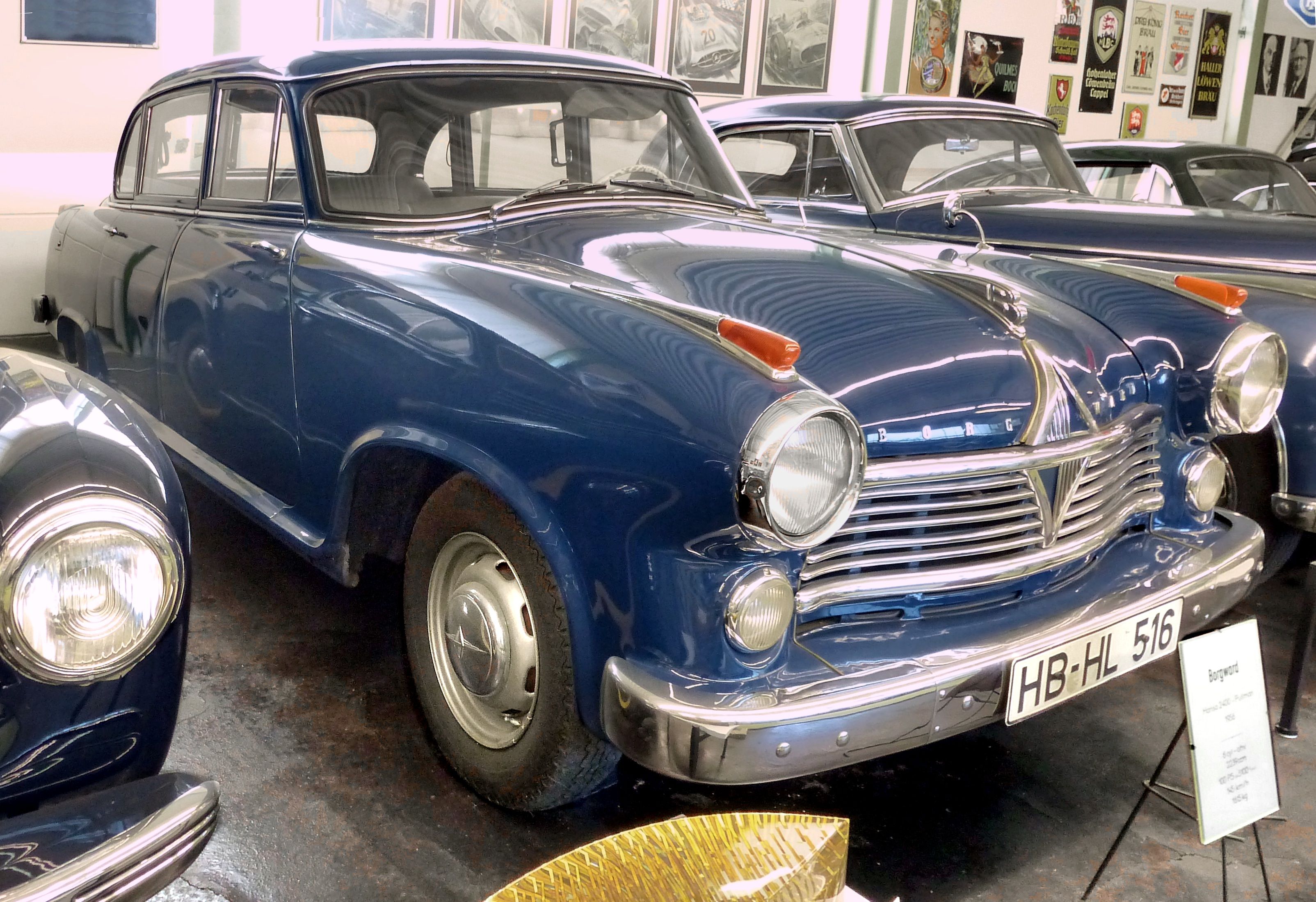 Blue 1956 Borgward Hansa 2400 Pullman saloon in a museum, front three-quarter view