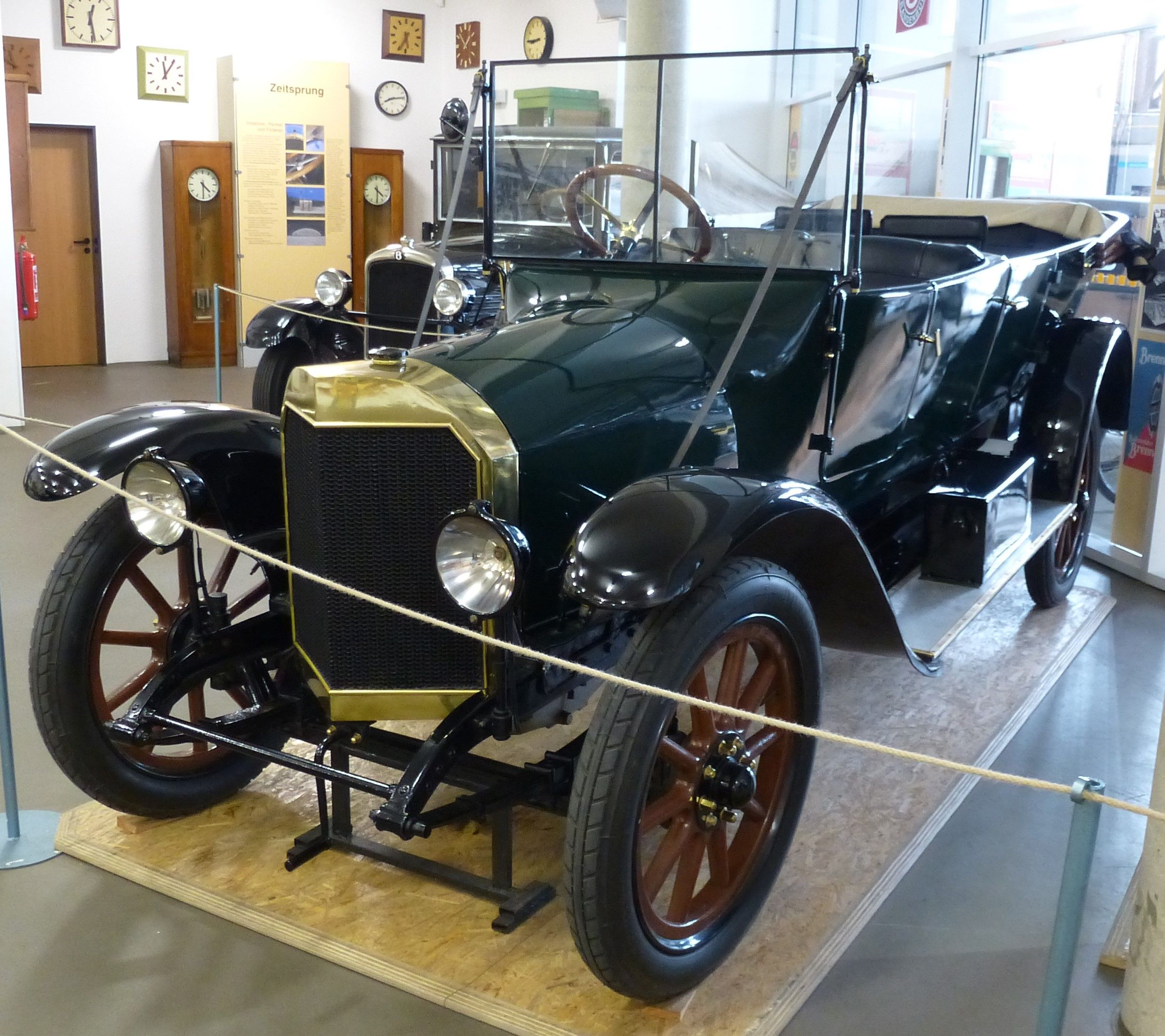 Brennabor Typ P 1920 open tourer in dark green with brass radiator, front three-quarter view