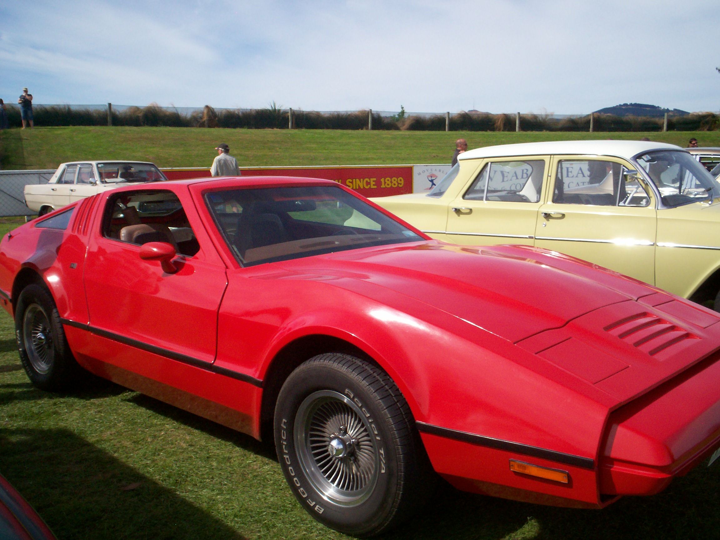 Red 1975 Bricklin SV1 coupe, front three-quarter side view