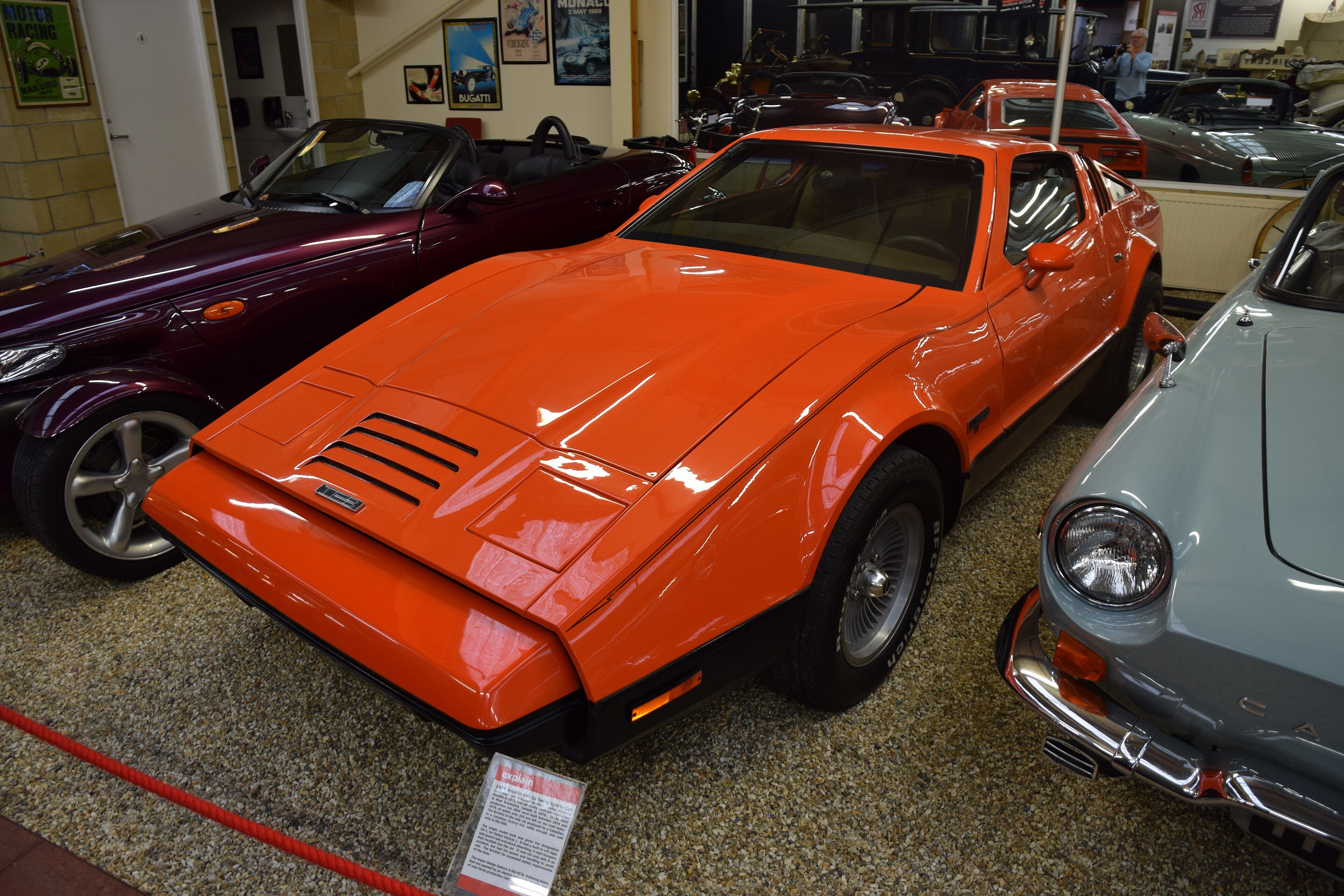 Orange 1975 Bricklin SV1 gull-wing coupe, front three-quarter view