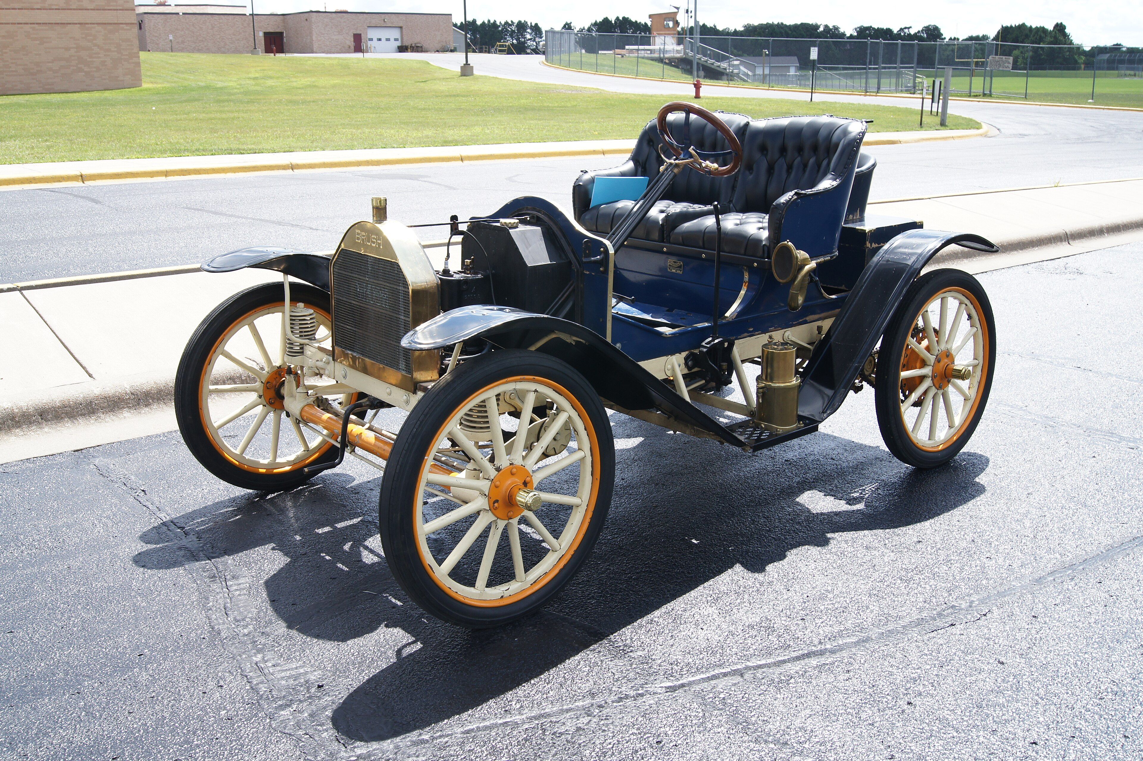 Blue 1911 Brush E28 Runabout with brass radiator, front three-quarter view