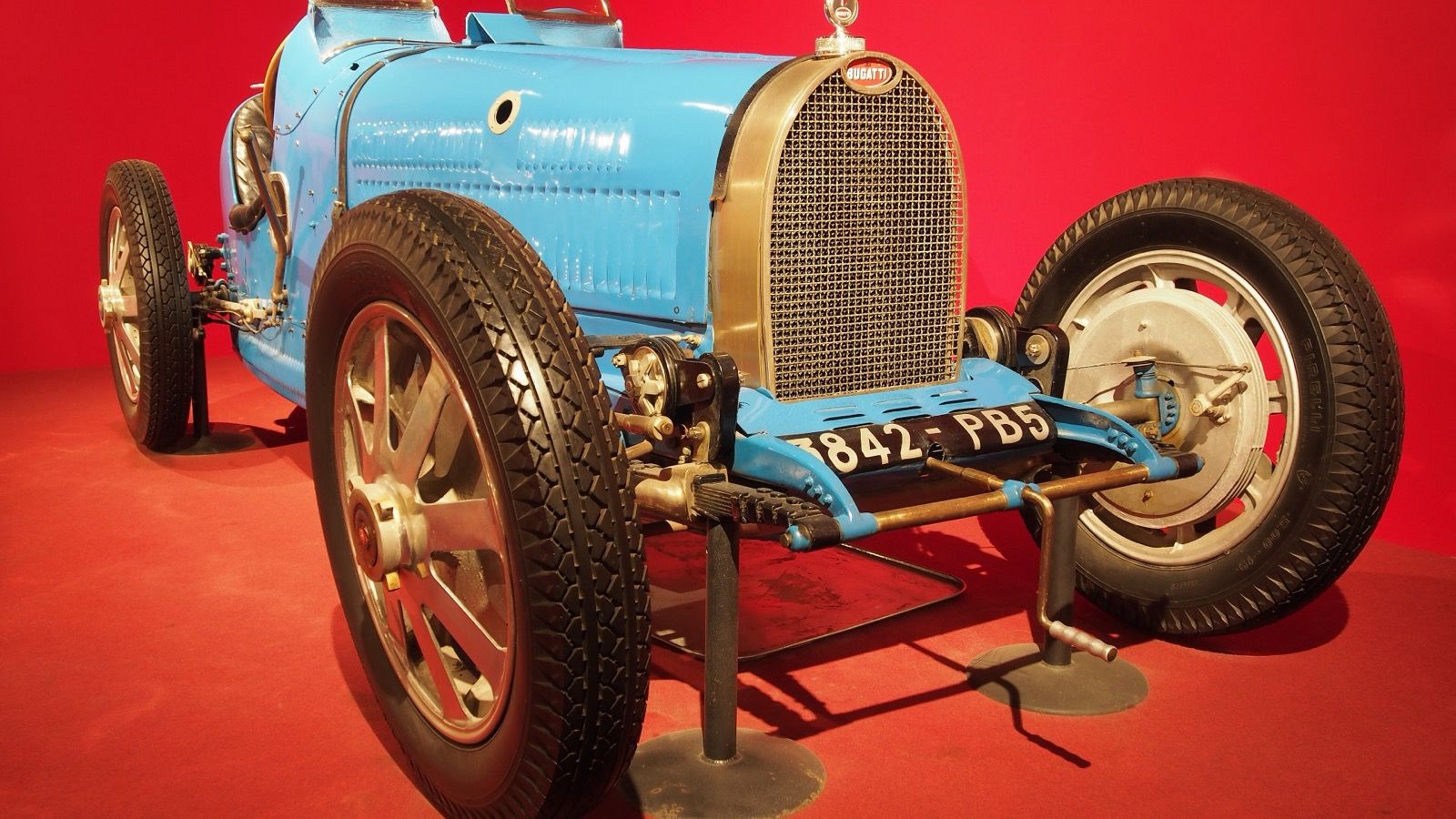 Blue 1929 Bugatti Type 35B open-wheel Grand Prix car, front three-quarter view