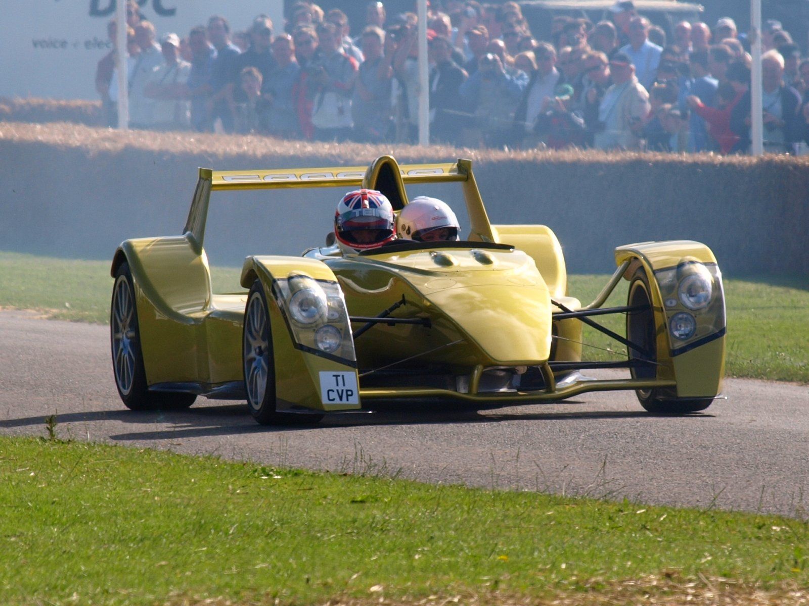 Gold-green Caparo T1 being driven at the 2008 Goodwood Festival of Speed, front three-quarter view