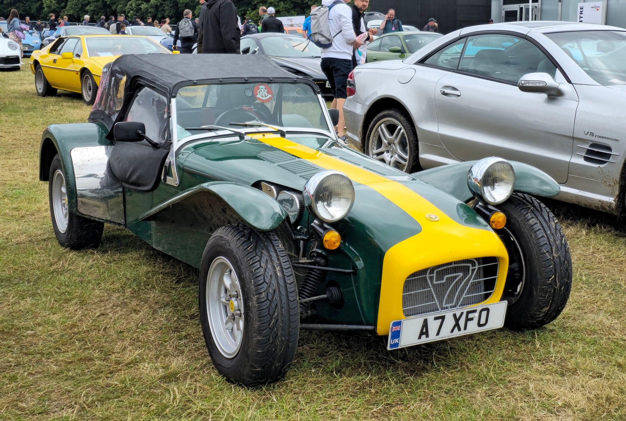 Green and yellow 1997 Caterham Super Seven narrow-body roadster, front three-quarter view
