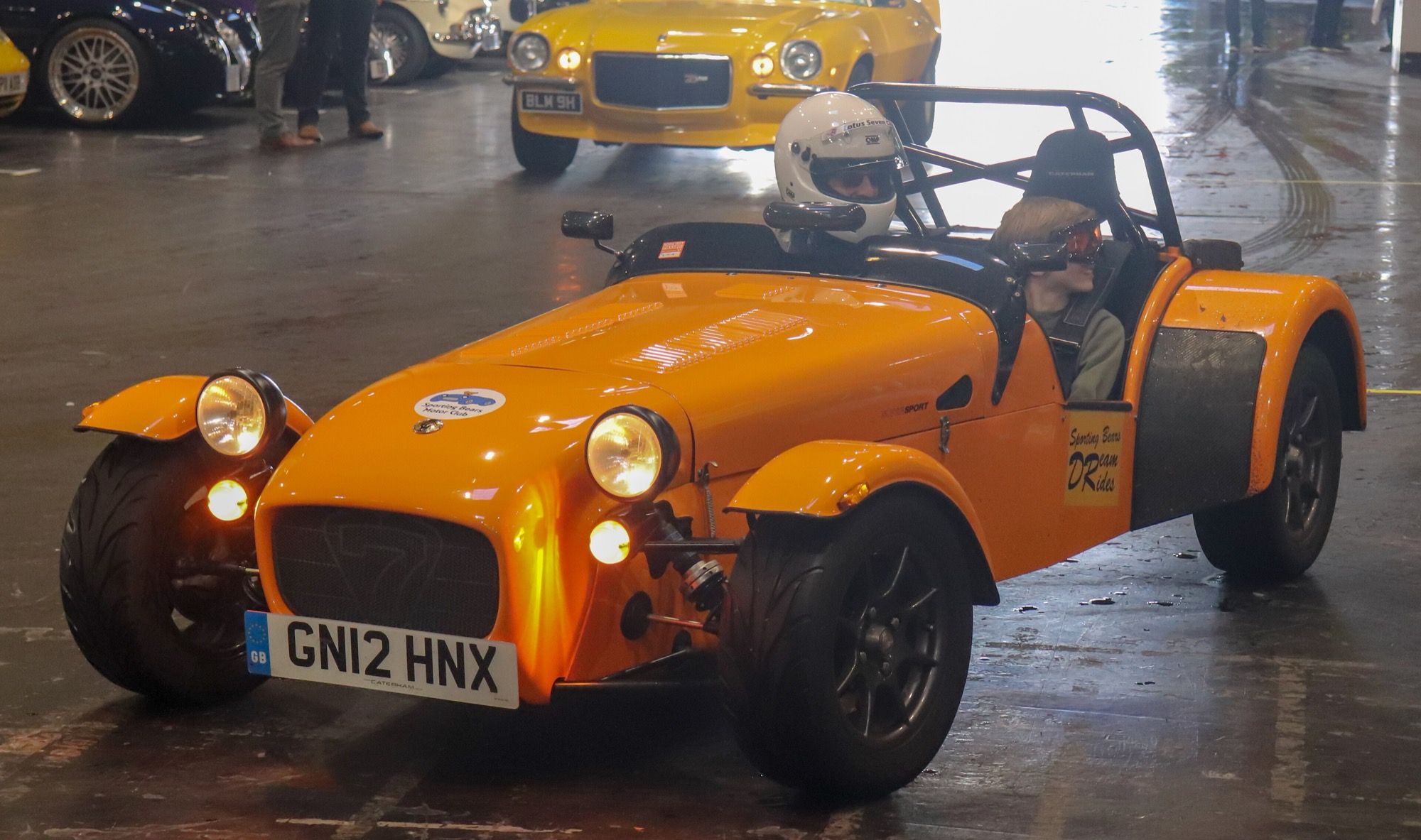 Orange 2012 Caterham Seven Supersport 1.6 roadster, front three-quarter view