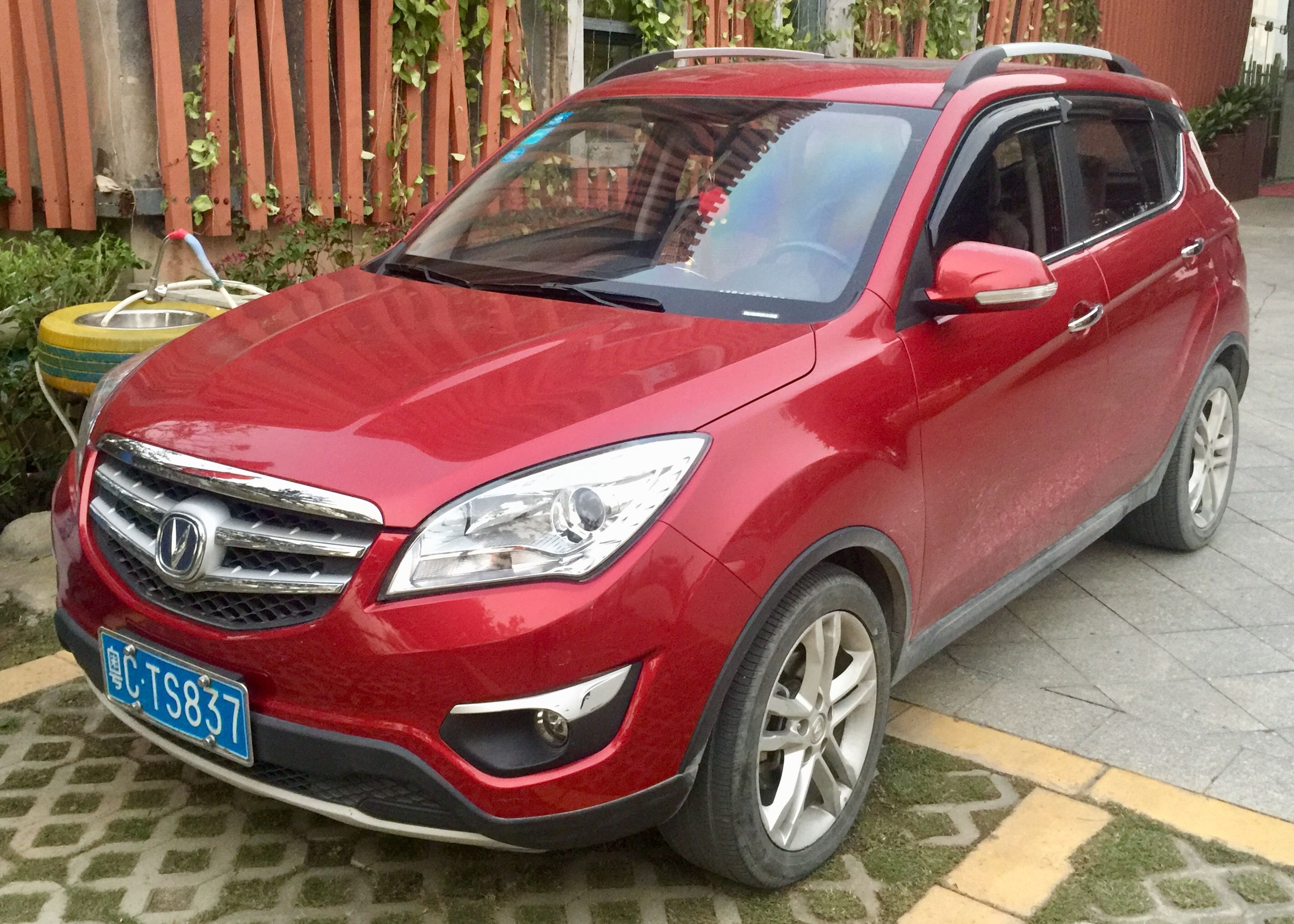 Red 2012 Changan CS35 subcompact SUV, front three-quarter view