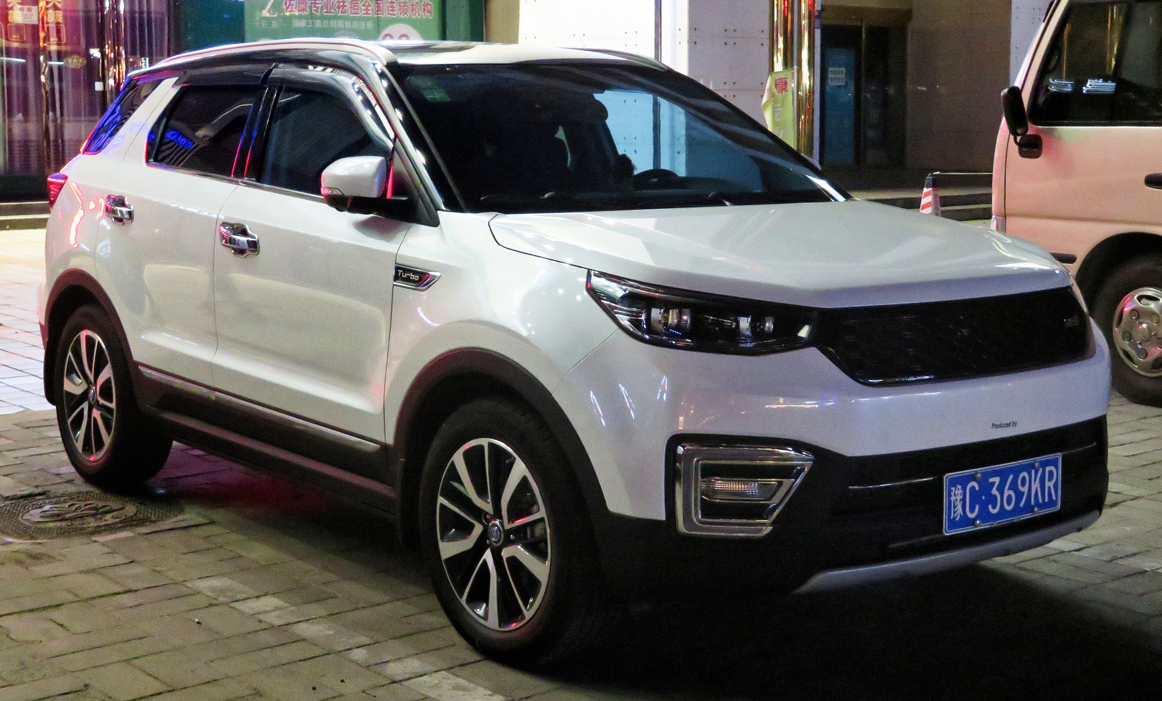 White 2018 Changan CS55 facelift compact SUV at night, front three-quarter view