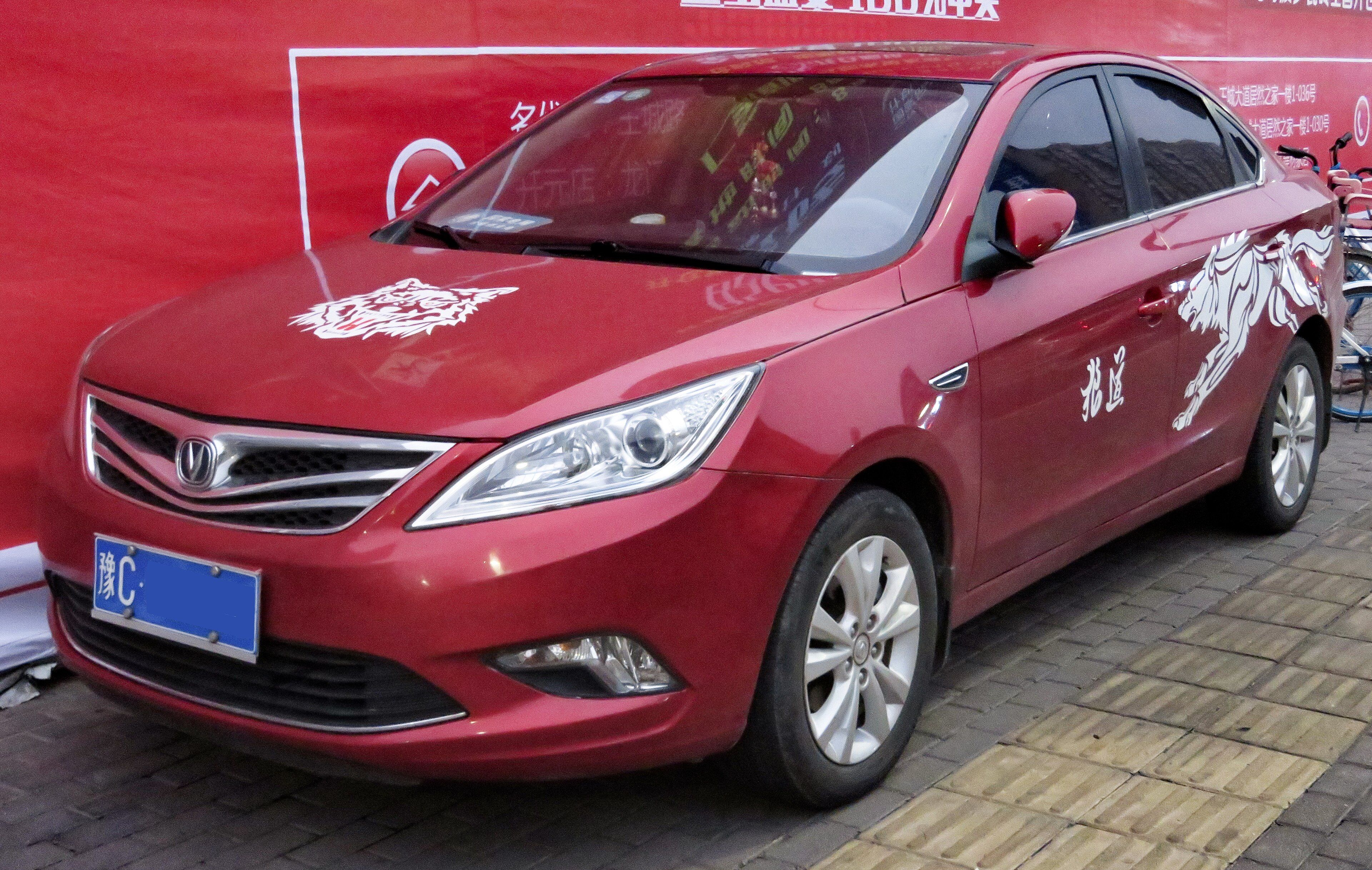 Red 2014 Changan Eado sedan with decal graphics, front three-quarter view