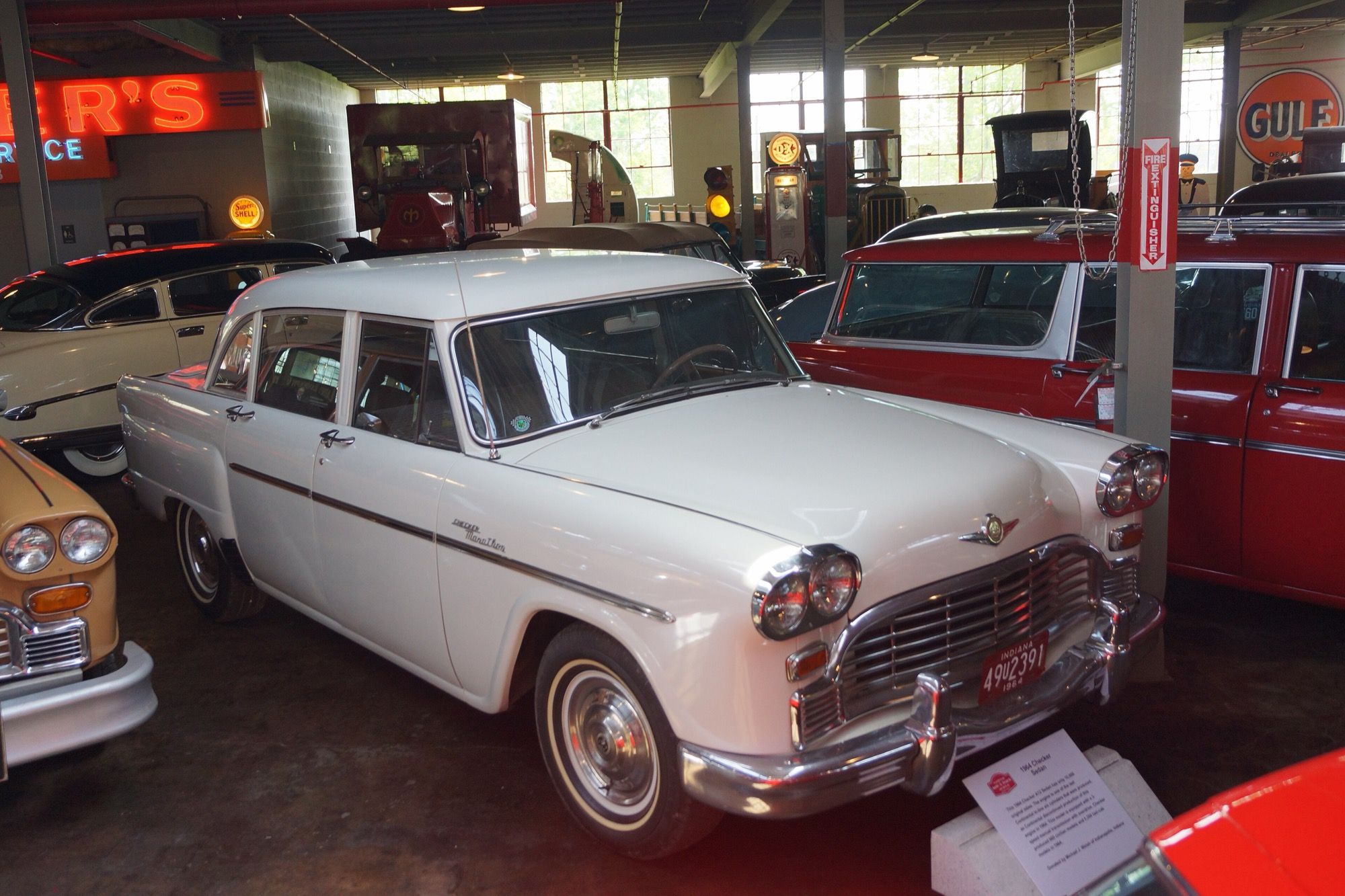 White 1964 Checker Marathon sedan, front three-quarter view