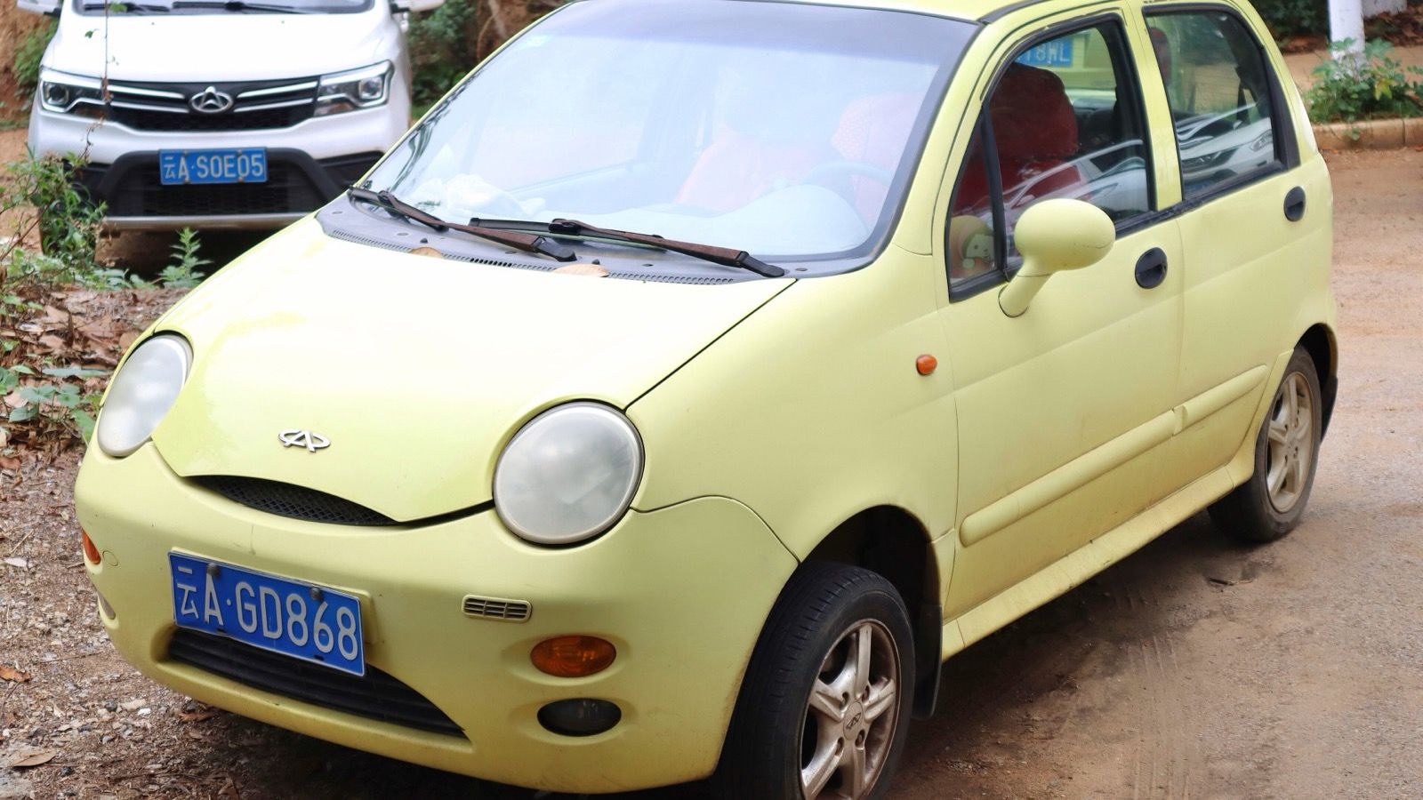 Yellow Chery QQ city hatchback, front three-quarter view