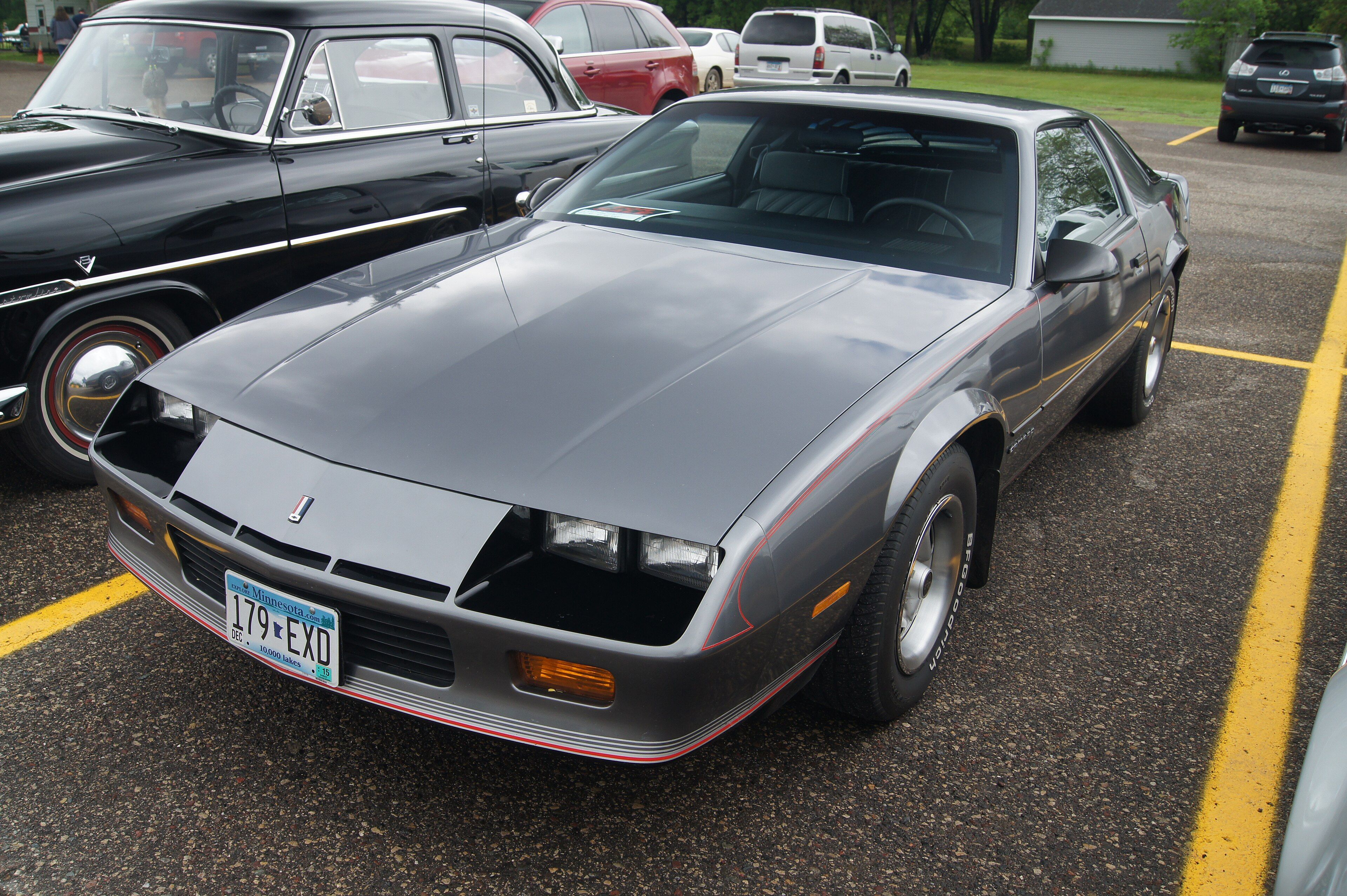 Grey 1987 Chevrolet Camaro coupe at a car show, front three-quarter view