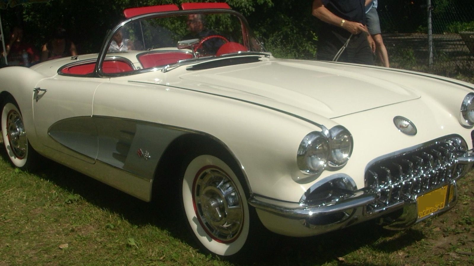 1959 Chevrolet Corvette, C1 first generation — white convertible with red interior, front three-quarter view