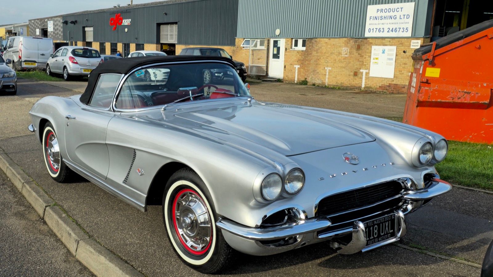 1961 Chevrolet Corvette, C1 first generation — silver convertible with ducktail rear, front three-quarter view