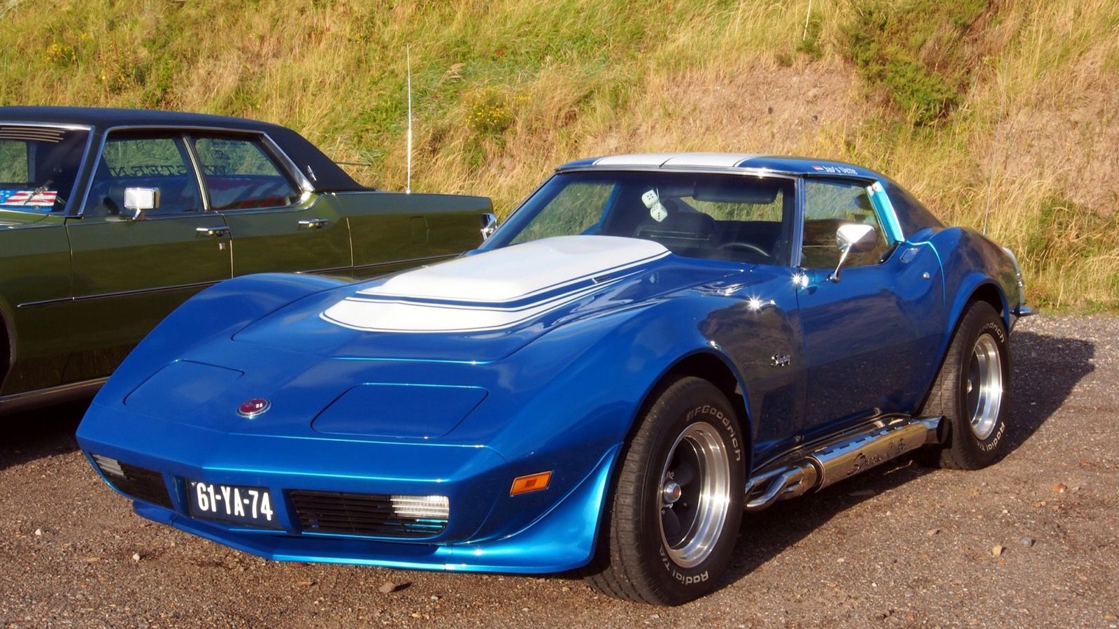 1973 Chevrolet Corvette Stingray, C3 third generation — blue coupe with body-color nose, front three-quarter view